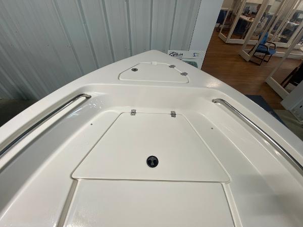 2024 Key West 189 FS boat bow with storage compartments and stainless steel rails.