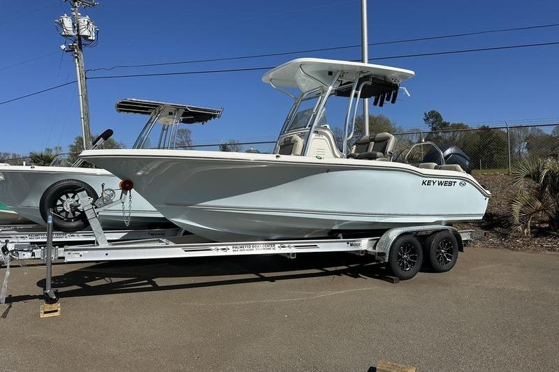 2026 Key West 219 FS boat on trailer under clear blue sky.