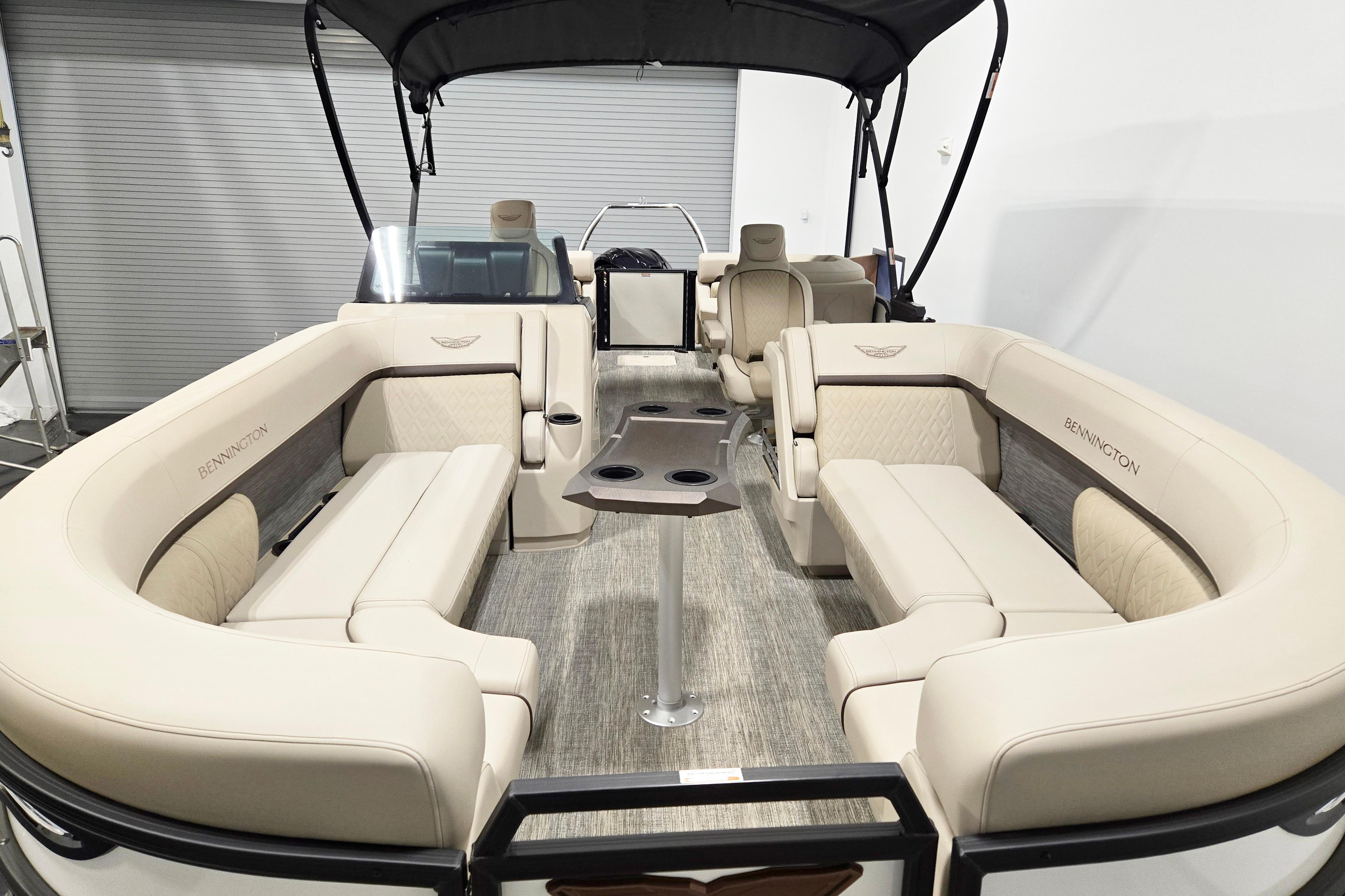 Luxurious 2026 Bennington 24 M pontoon boat interior with plush seating and modern design.