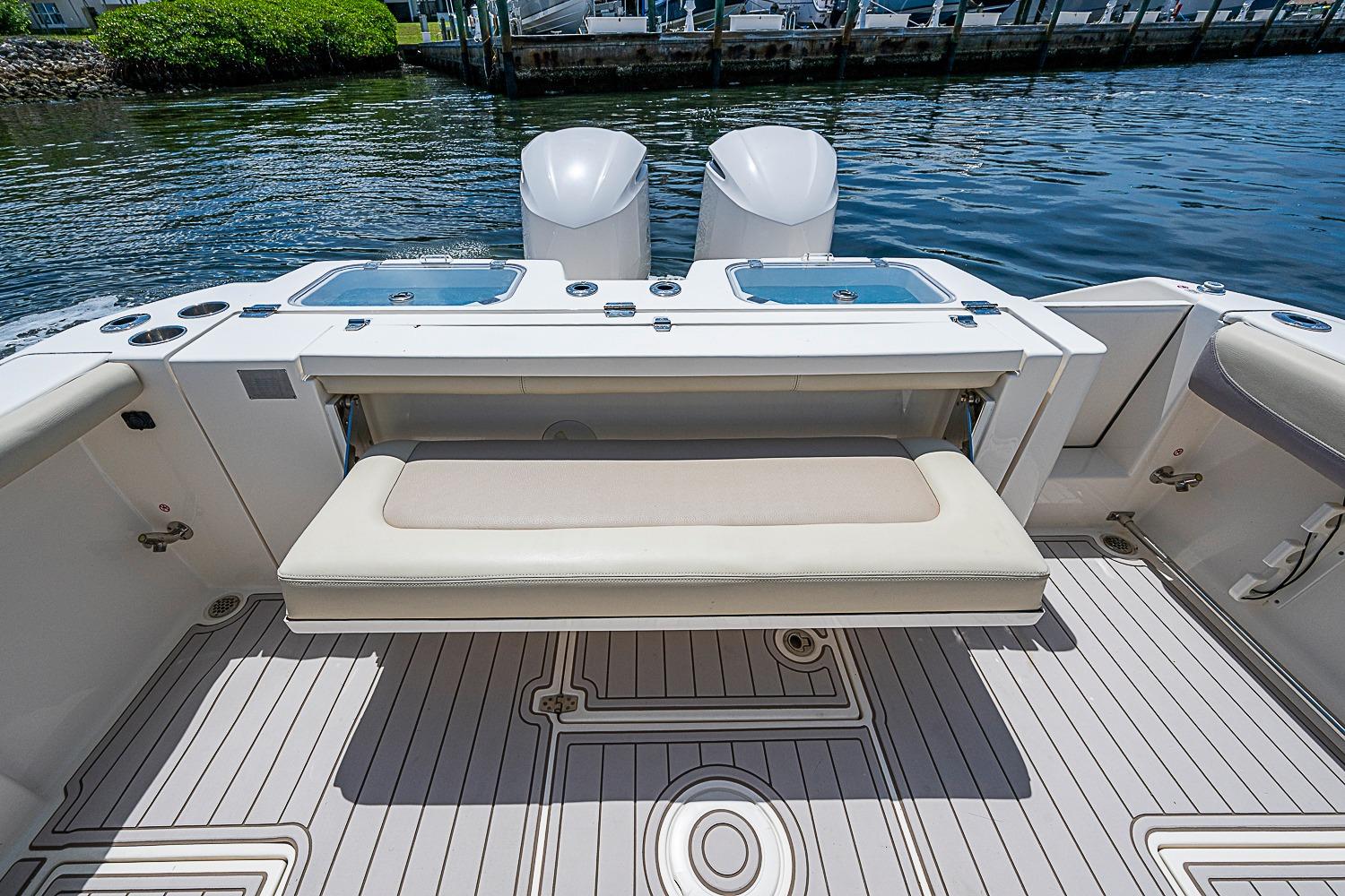 2019 Cobia 320 Center Console boat interior with seating and storage.