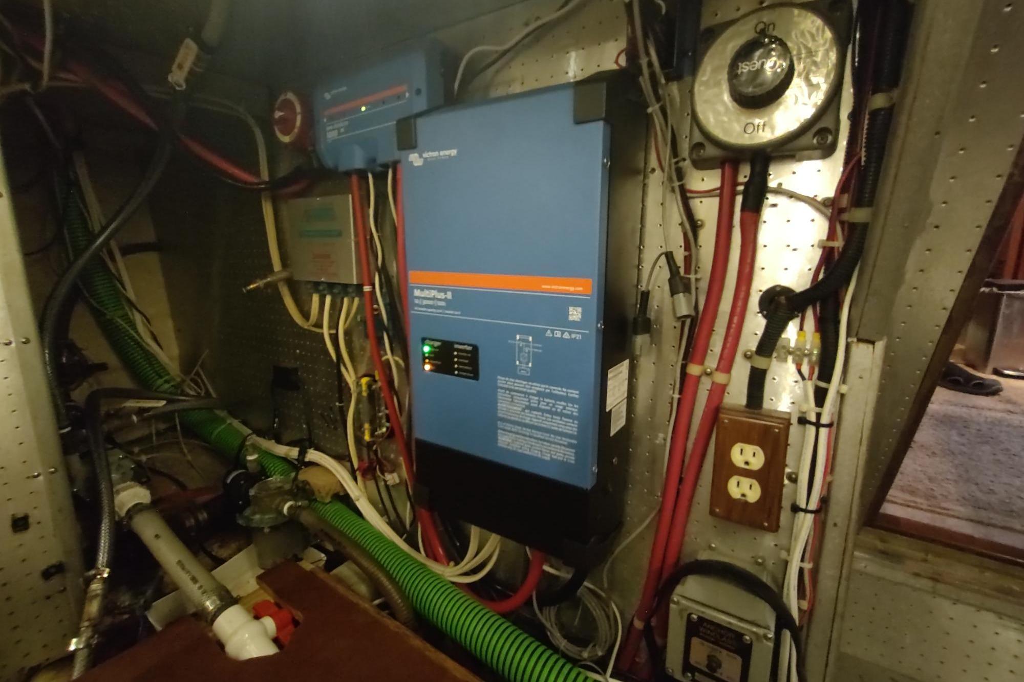 Electrical system inside a 1989 Hyatt Double Cabin Motoryacht, featuring wiring and control panels.