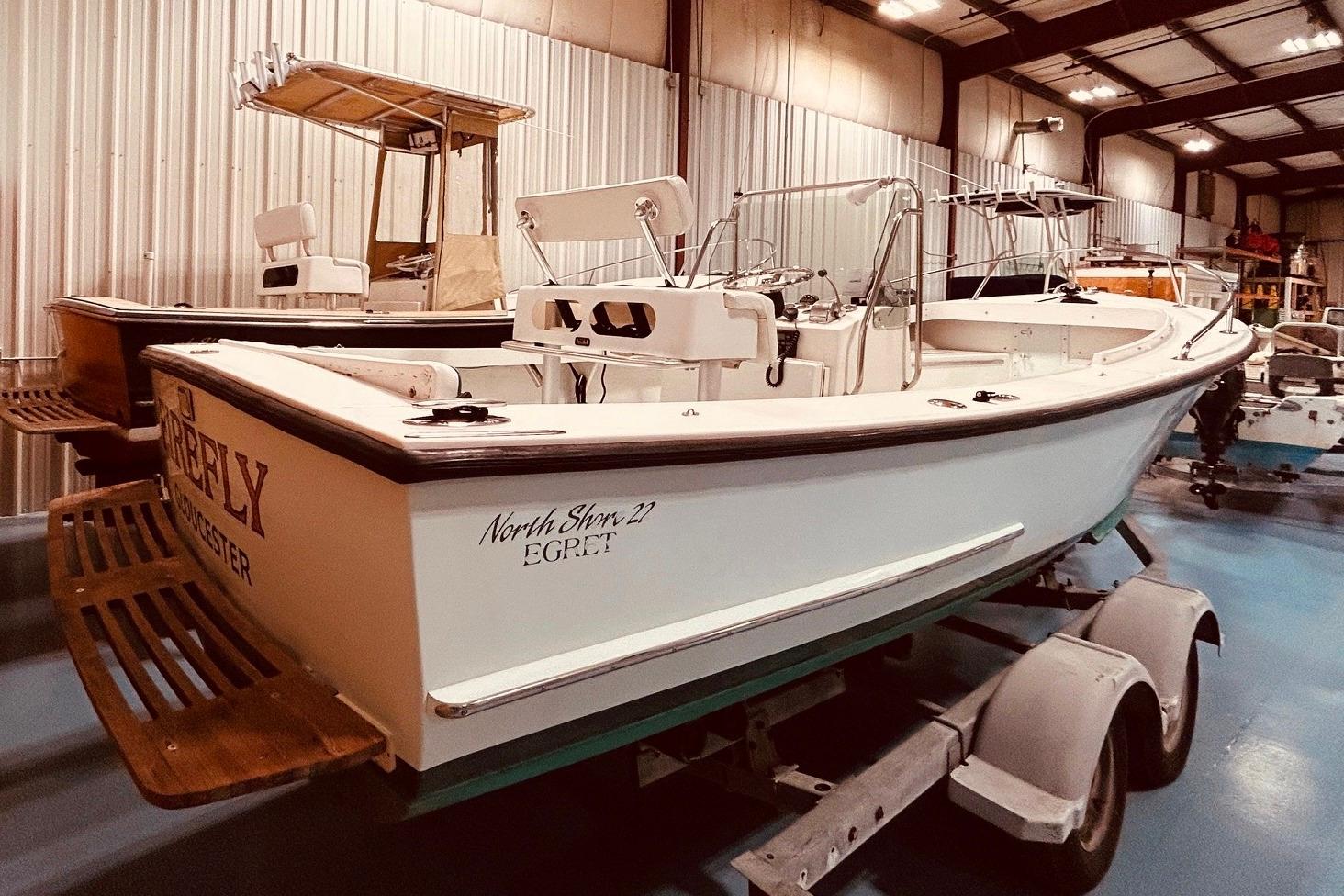 1999 North Shore 22 boat on trailer in indoor storage facility.
