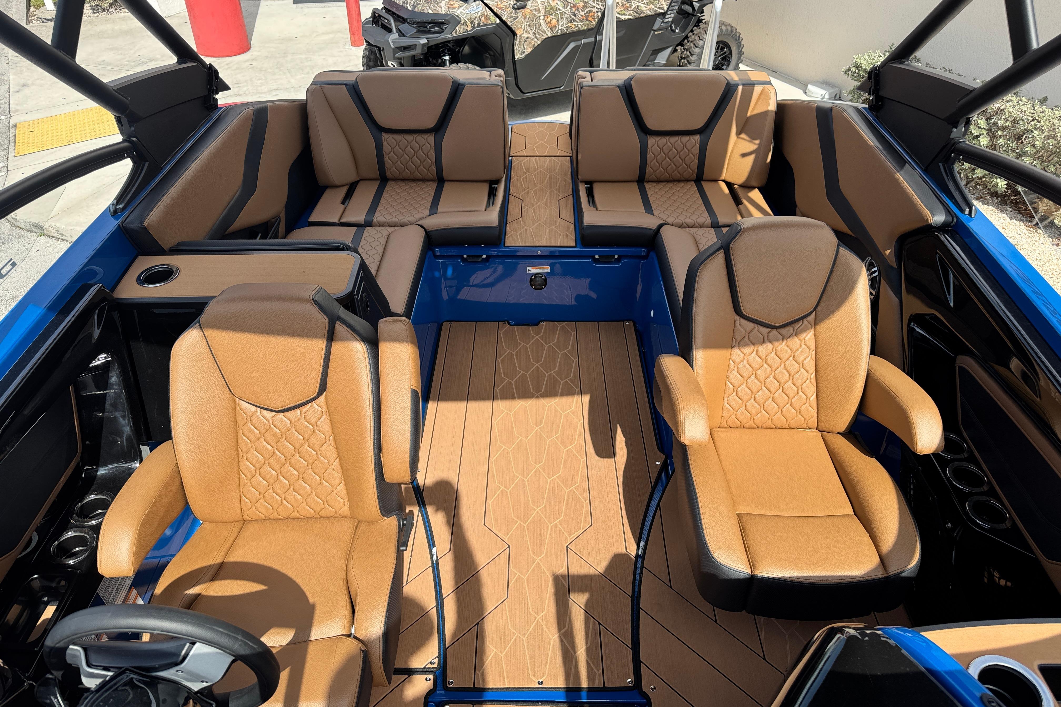 2026 Yamaha Boats 255XD interior with luxurious tan seating and sleek design.