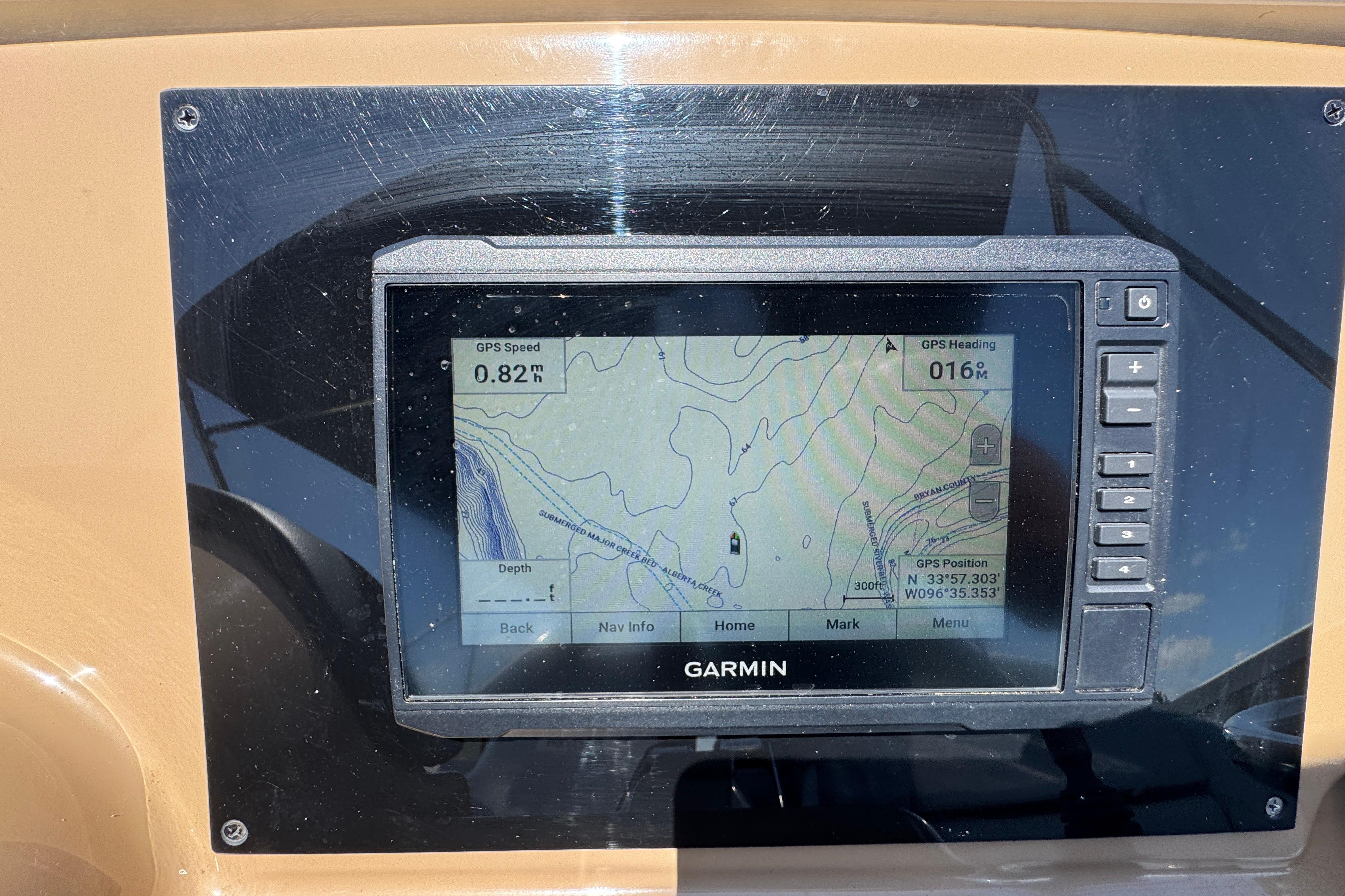 Garmin GPS display on 2002 Carver 396 Motor Yacht dashboard, showing navigation details.