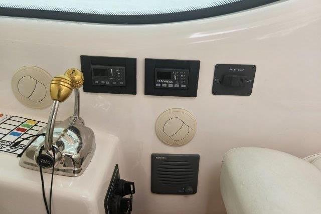 Control panel of 2008 Tiara Yachts 4300 Sovran with throttle and electronic displays.