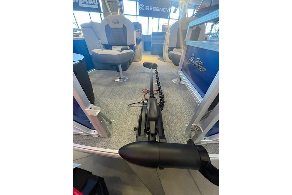 2026 Sun Tracker Fishin' Barge 20 DLX interior with seating and equipment.