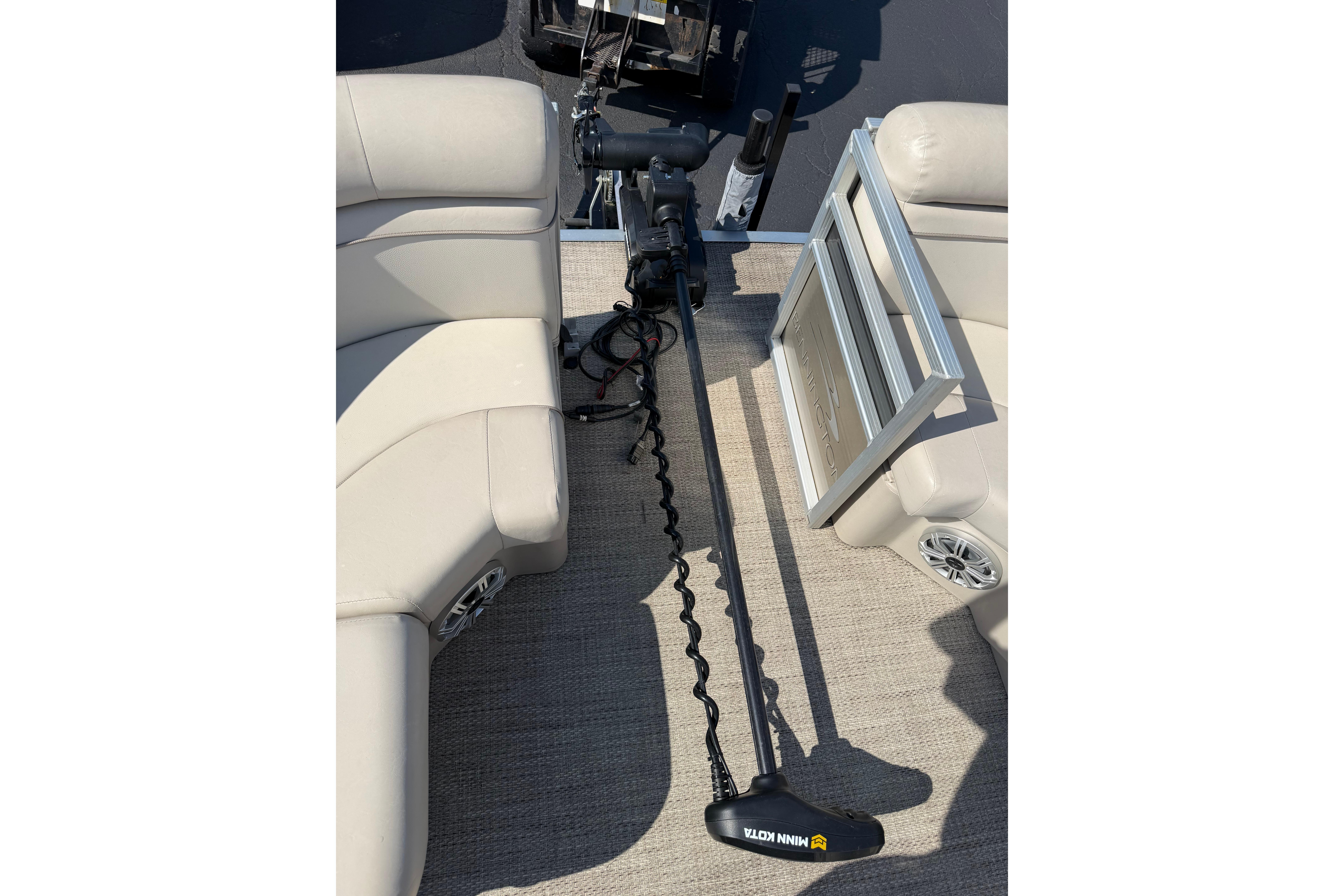 2018 Bennington 21 SF boat interior with Minn Kota trolling motor and beige seating.