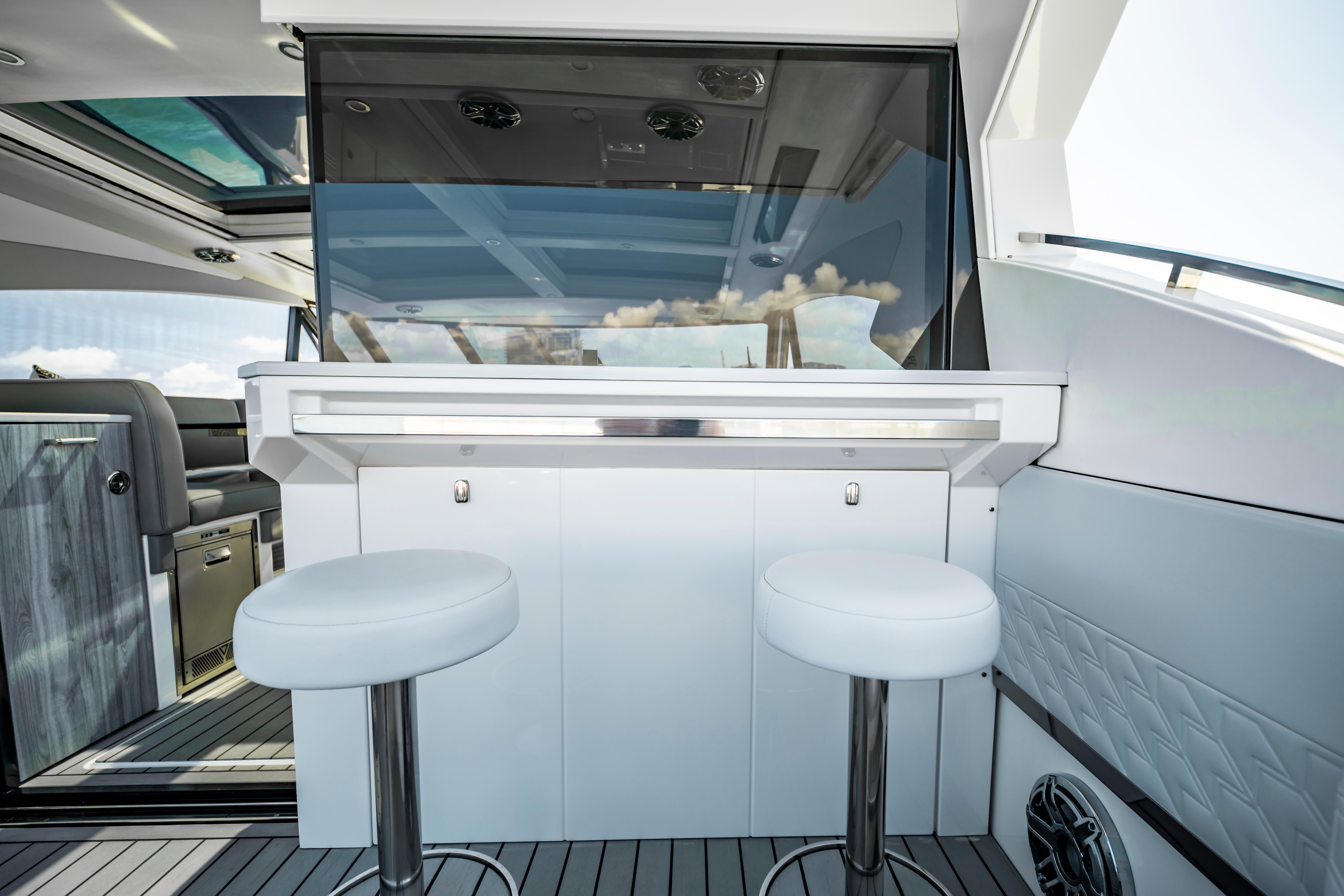 2022 Formula 500 Super Sport Crossover yacht interior with bar stools and sleek design.