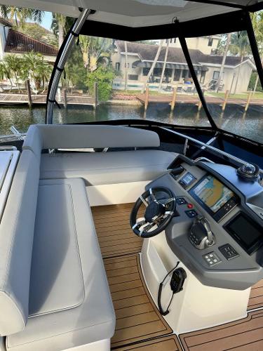 2022 Aquila 44 yacht helm with modern navigation system and comfortable seating.