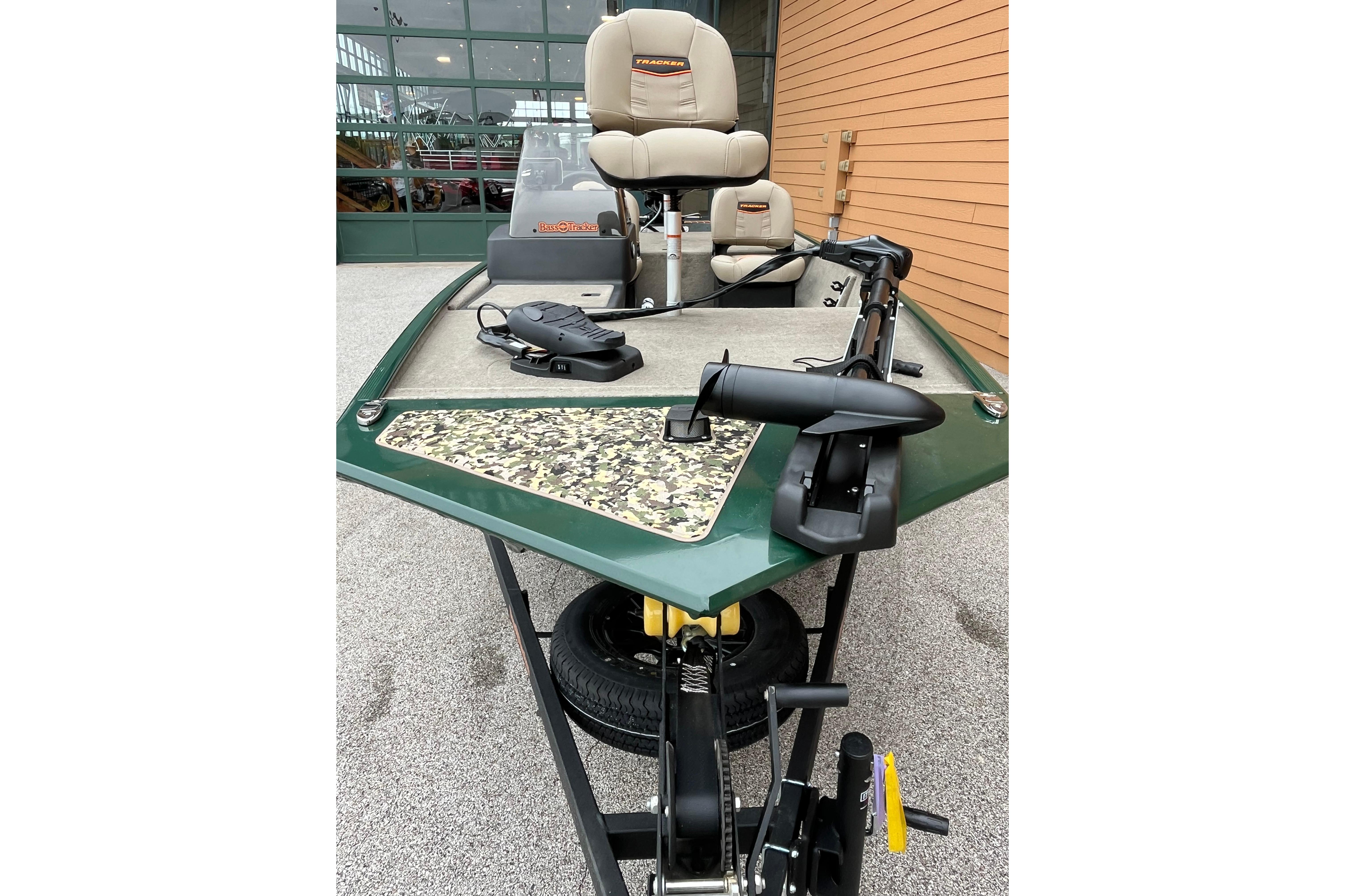 2026 Tracker Bass Tracker Classic Limited boat with camouflage deck and seating.