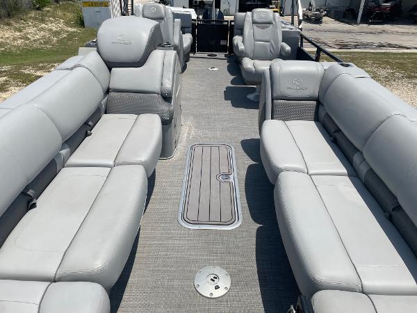 2023 Regency 250 LE3 pontoon boat with spacious gray seating and modern design.