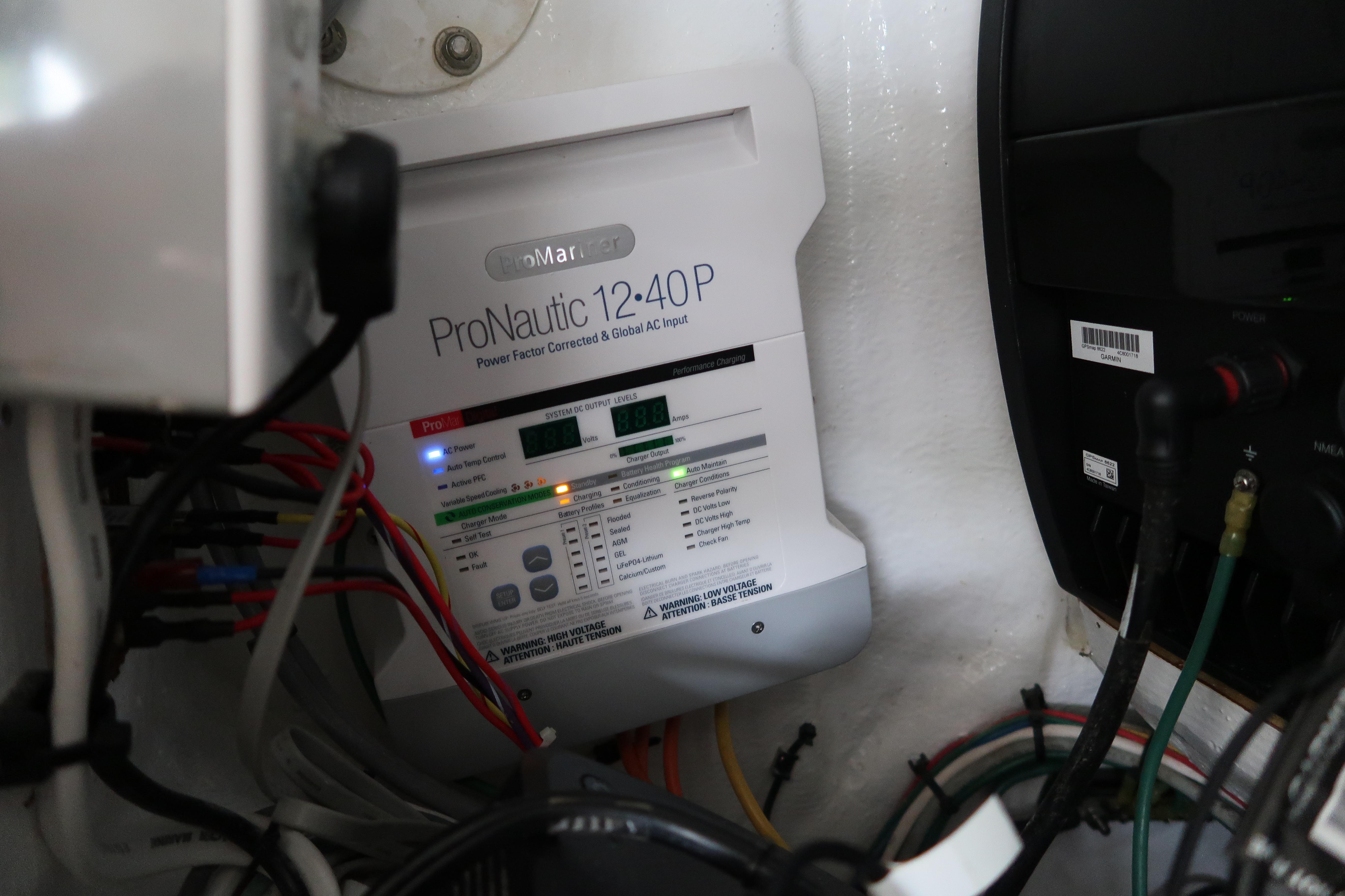 Battery charger and wiring inside a 2016 Invincible 42 Open Fisherman boat.