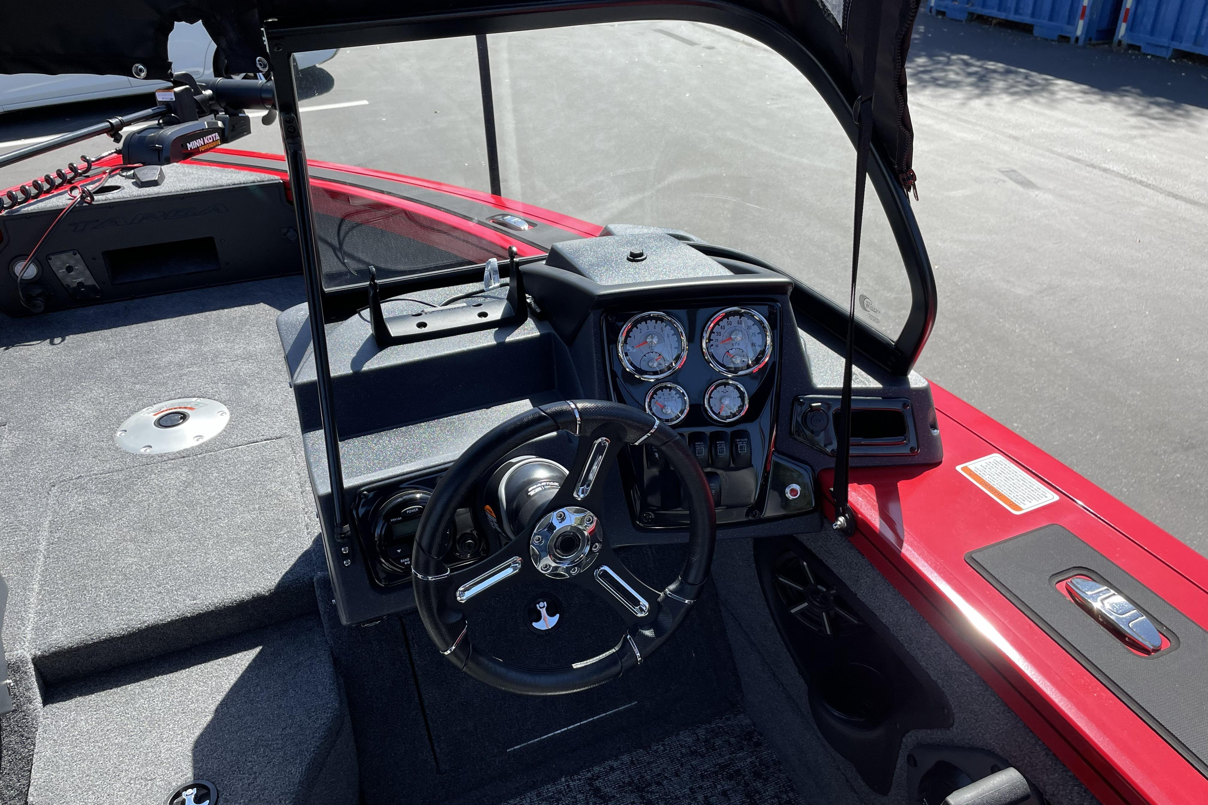 2026 Tracker Targa V-18 WT boat dashboard with steering wheel and gauges.