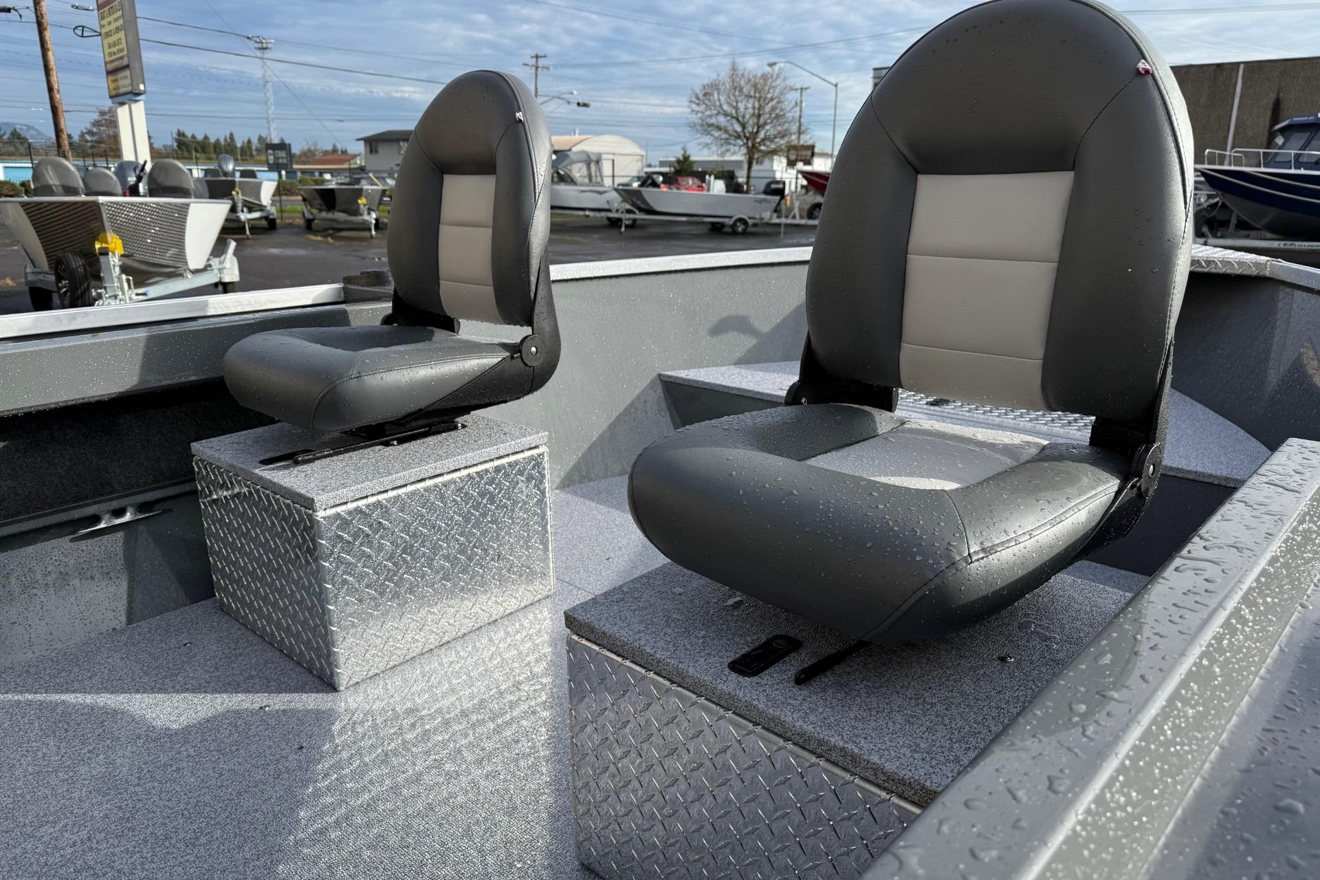2026 Fish Rite Angler 18 boat seats with diamond plate bases, outdoor setting.