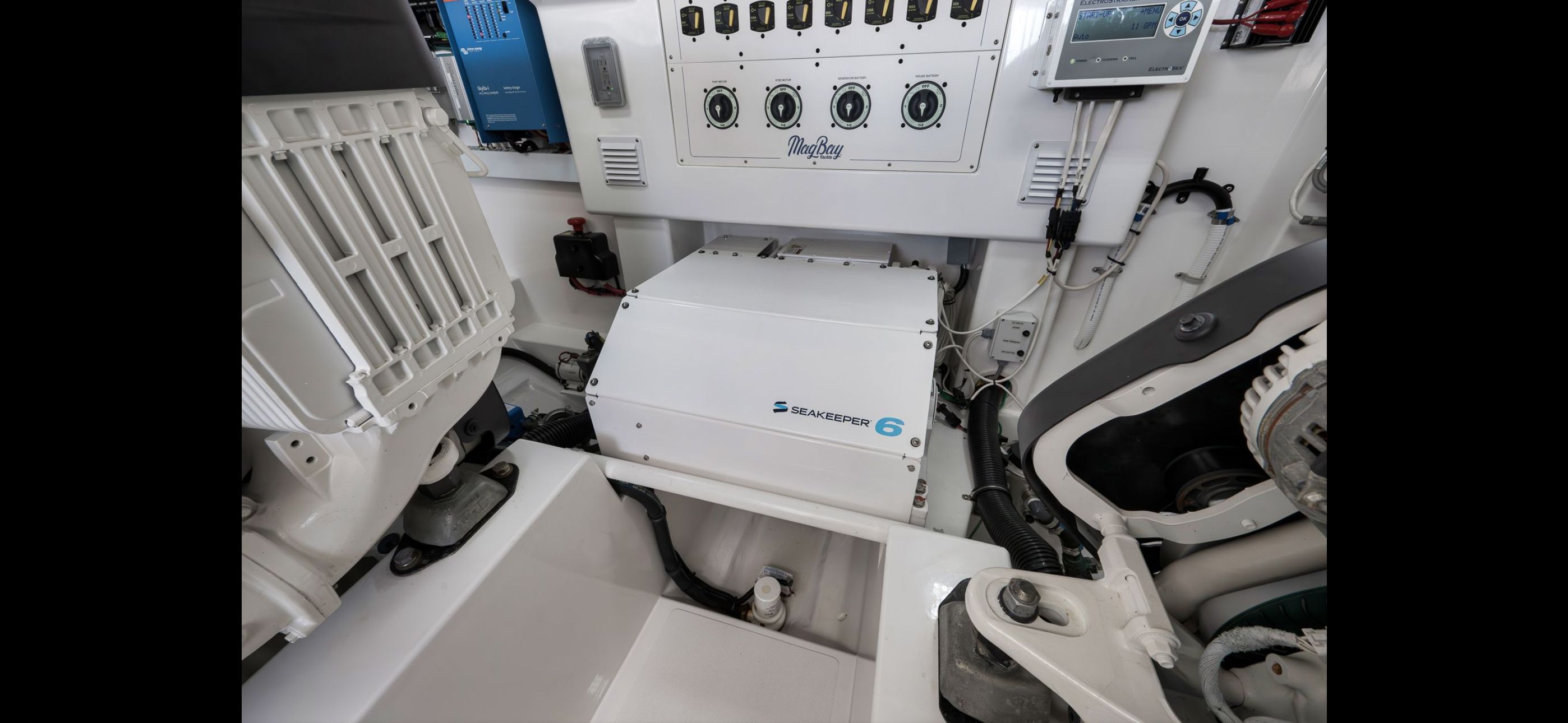 Engine room of 2022 Mag Bay 42 Express with Seakeeper 6.