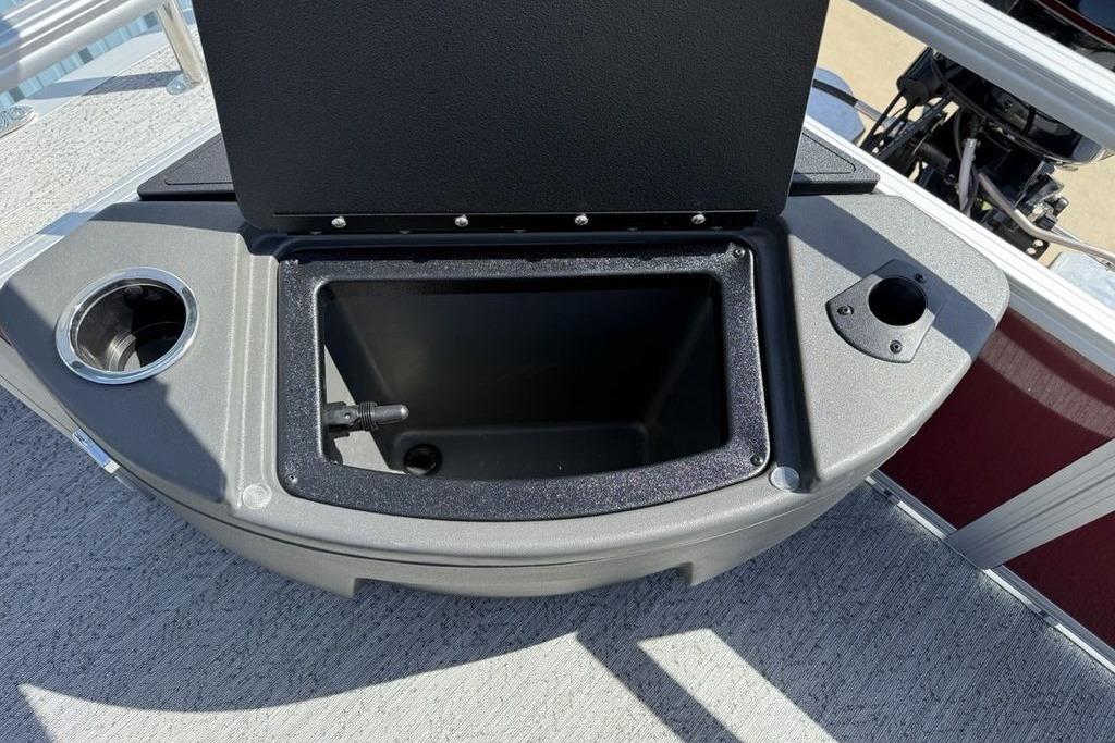 Open storage compartment on 2026 Sun Tracker Bass Buggy 18 DLX boat deck.