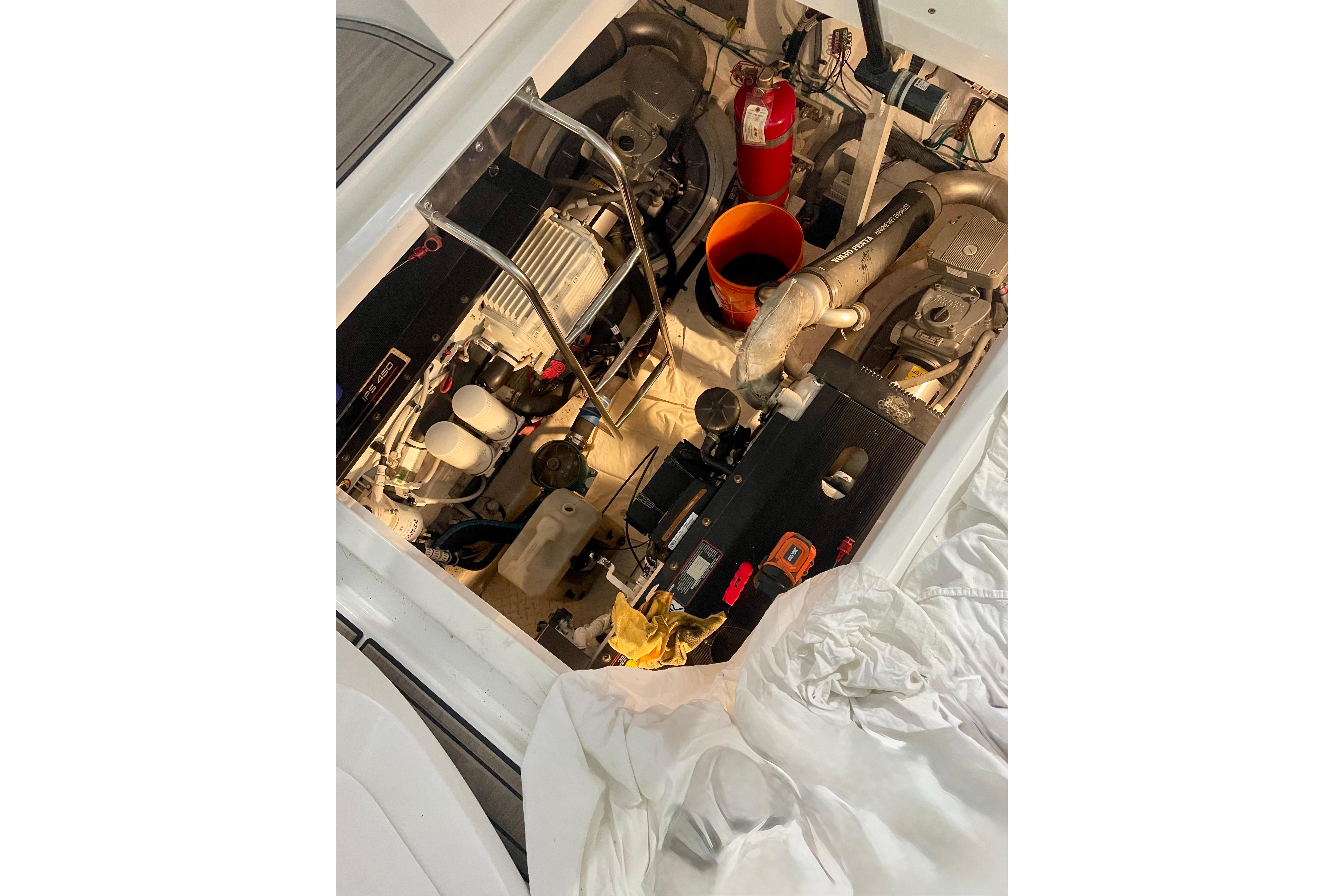 Engine compartment of a 2011 Cruisers Yachts 390 Sports Coupe, showcasing mechanical components.