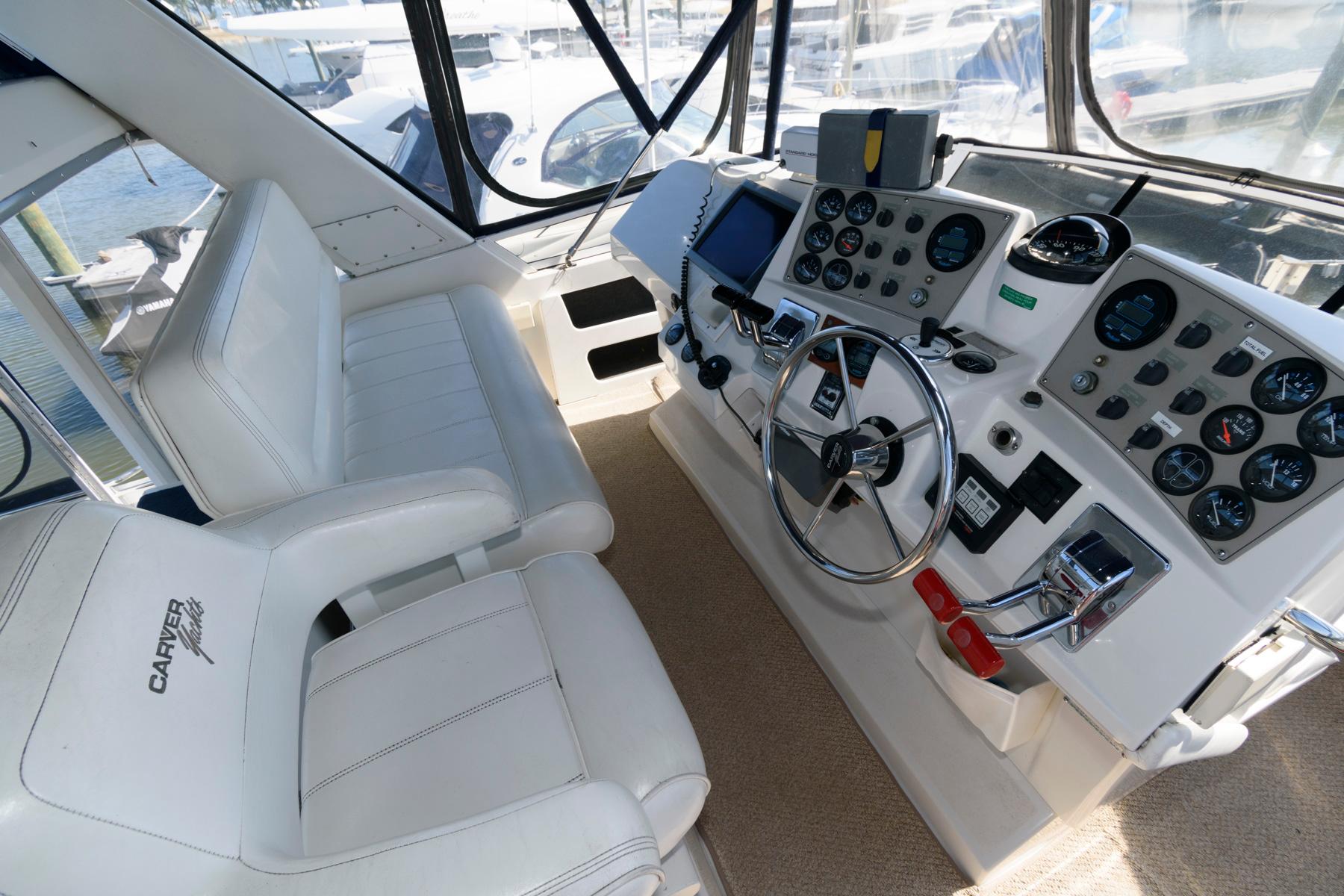 Interior of 1997 Carver 400 Cockpit Motor Yacht, helm with instruments.
