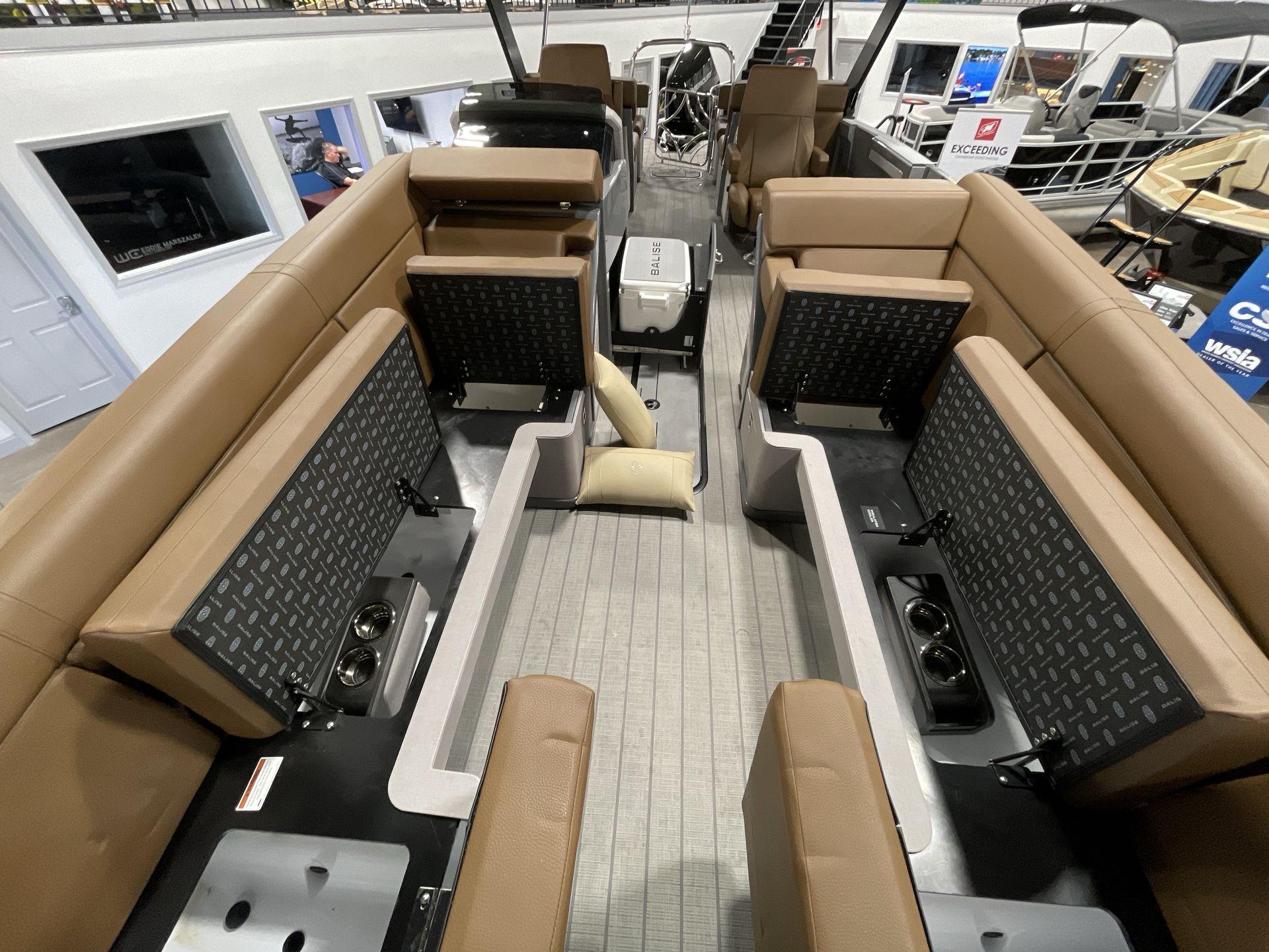 Interior of 2025 Balise Horizon 26C boat with tan seating and modern design.