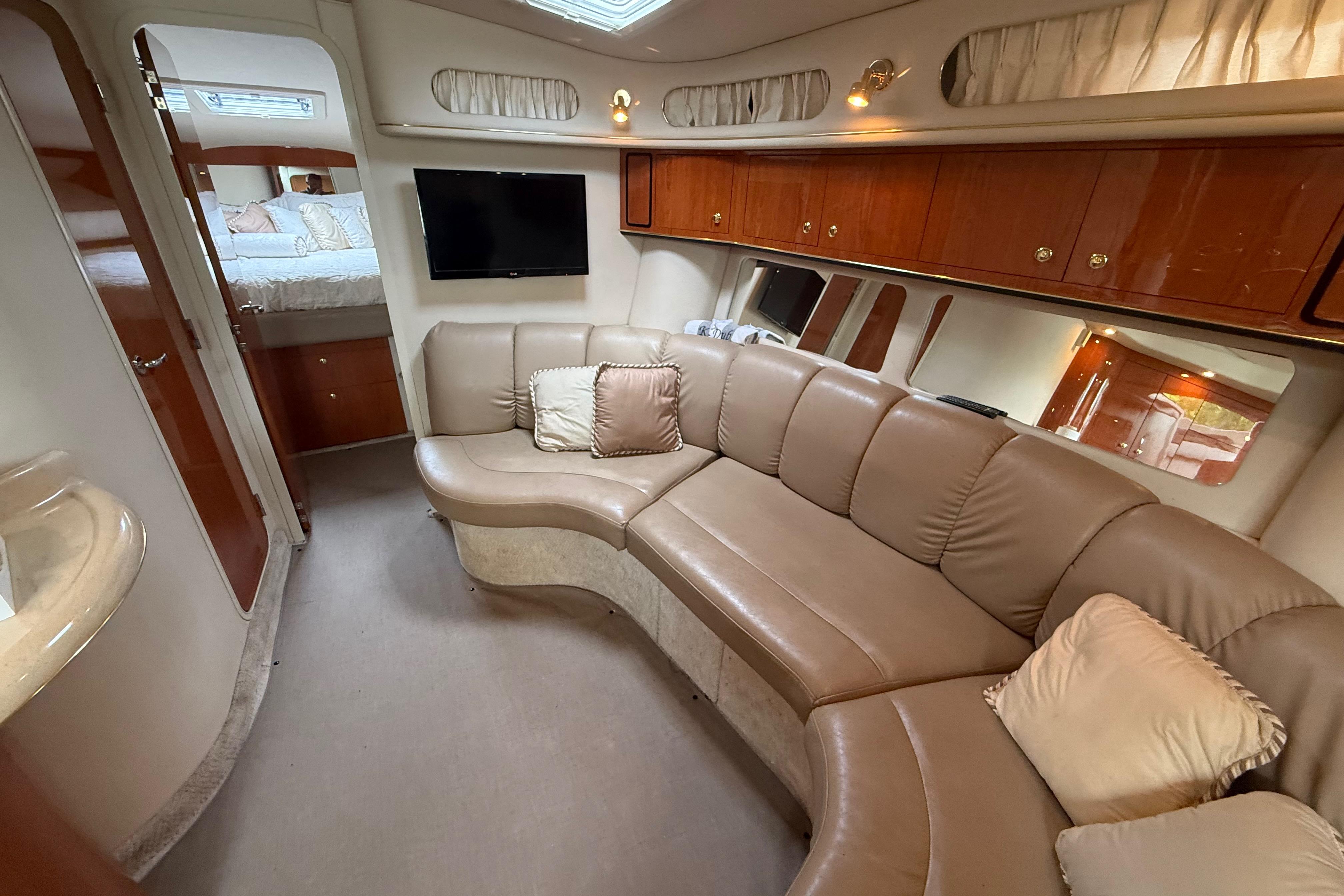 Luxurious interior of 1998 Sea Ray Sundancer 400 yacht with plush seating and modern amenities.