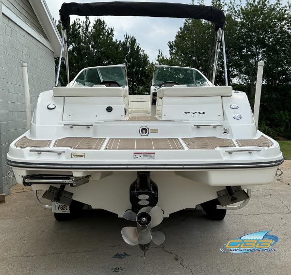 2008 Sea Ray 270 SLX boat, rear view with dual propellers and swim platform.