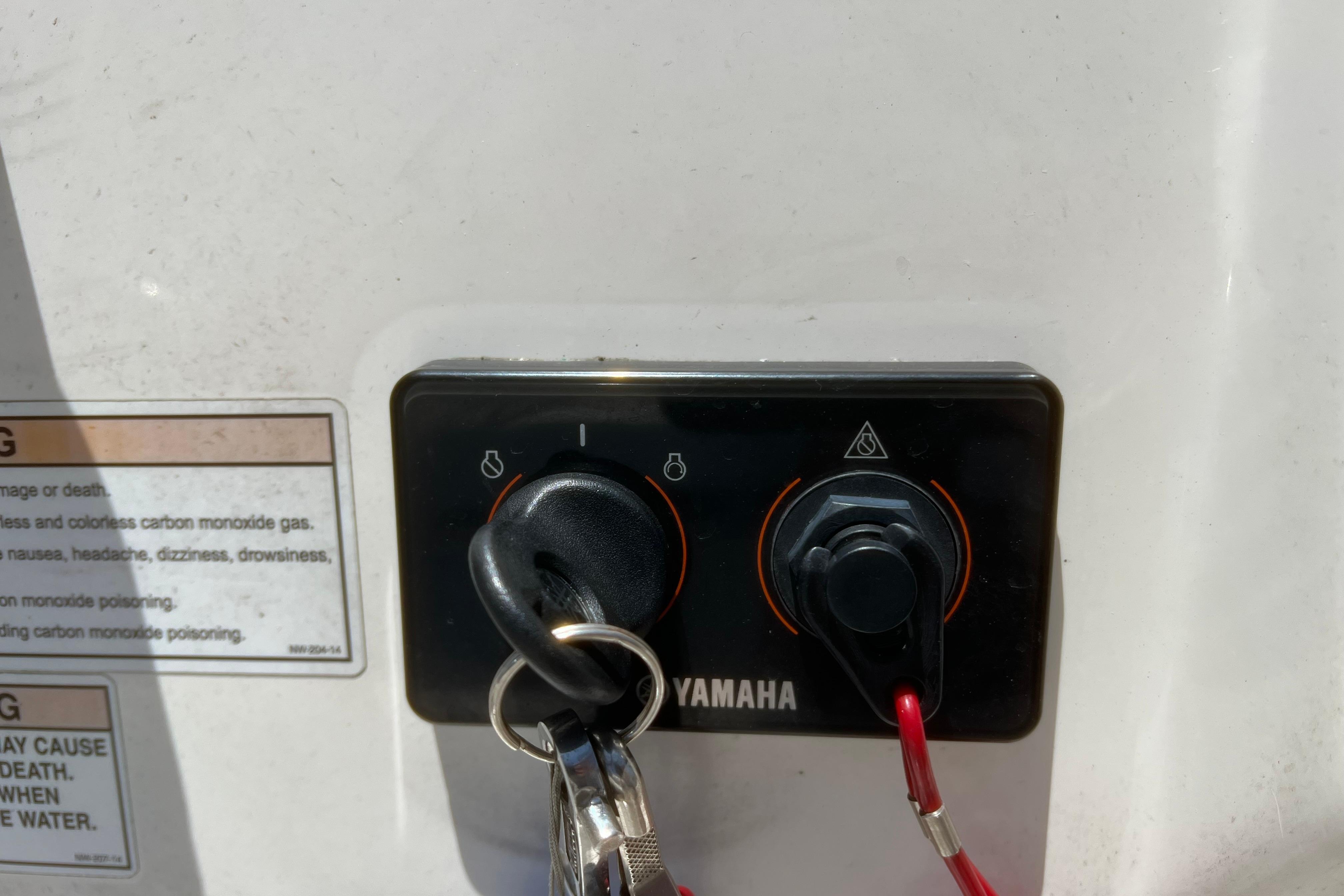 Yamaha ignition panel with keys on a 2018 Cobia 201 Center Console boat.