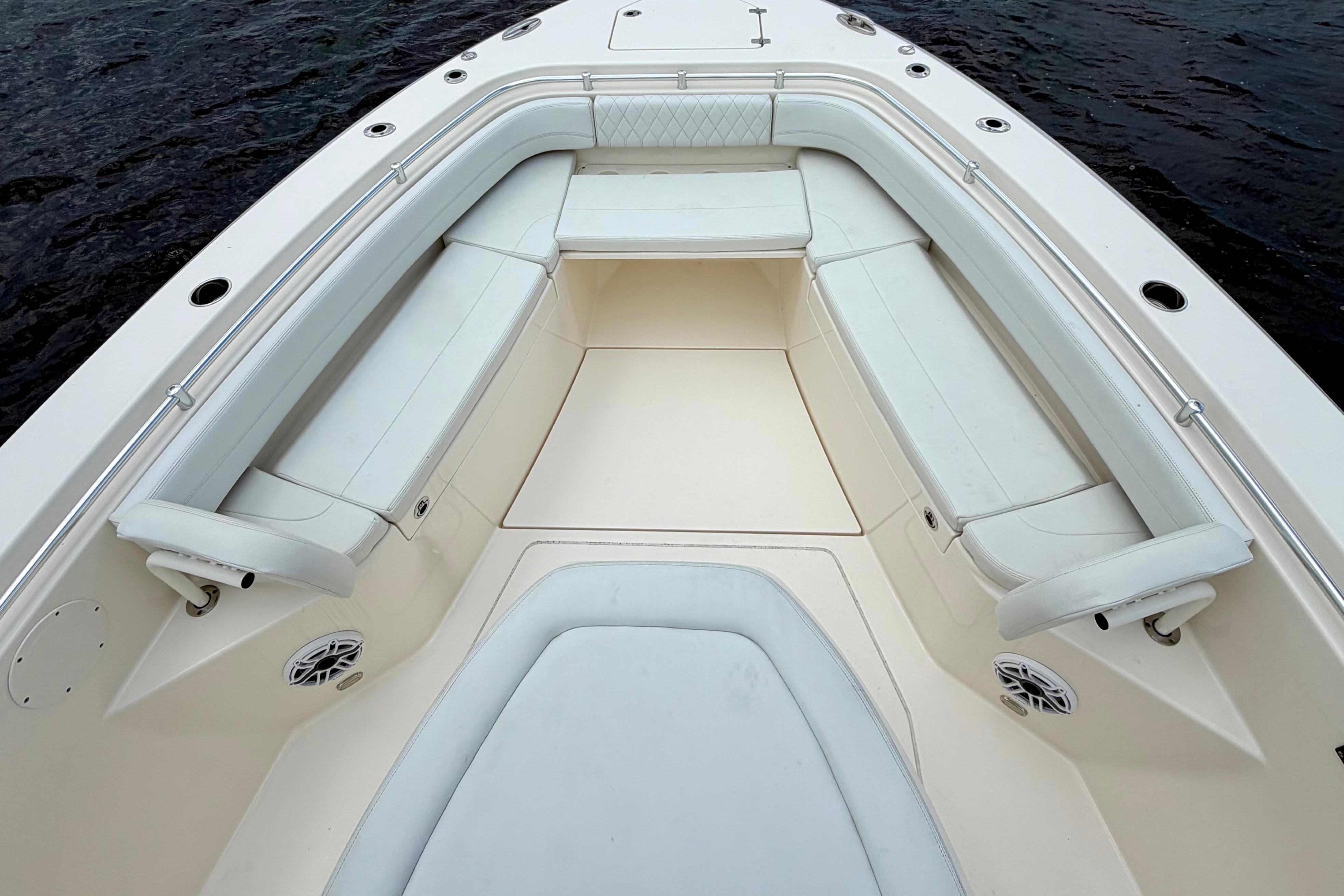 2023 Cobia 350 Center Console boat with spacious seating and sleek design on water.