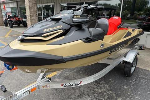 2025 Sea-Doo RXT-X 325 jet ski on trailer, gold and black design, parked outdoors.