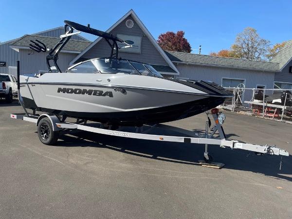 2025 Moomba Mondo boat on trailer, parked outdoors near buildings.