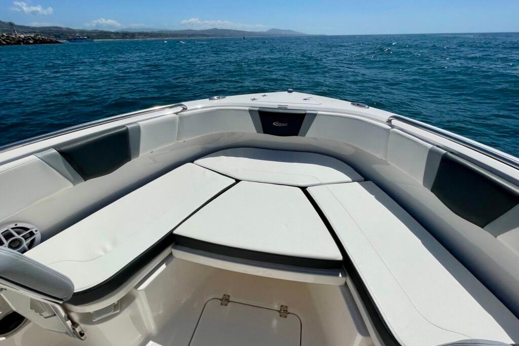 2022 Robalo R230 Center Console boat interior with cushioned seating on open water.