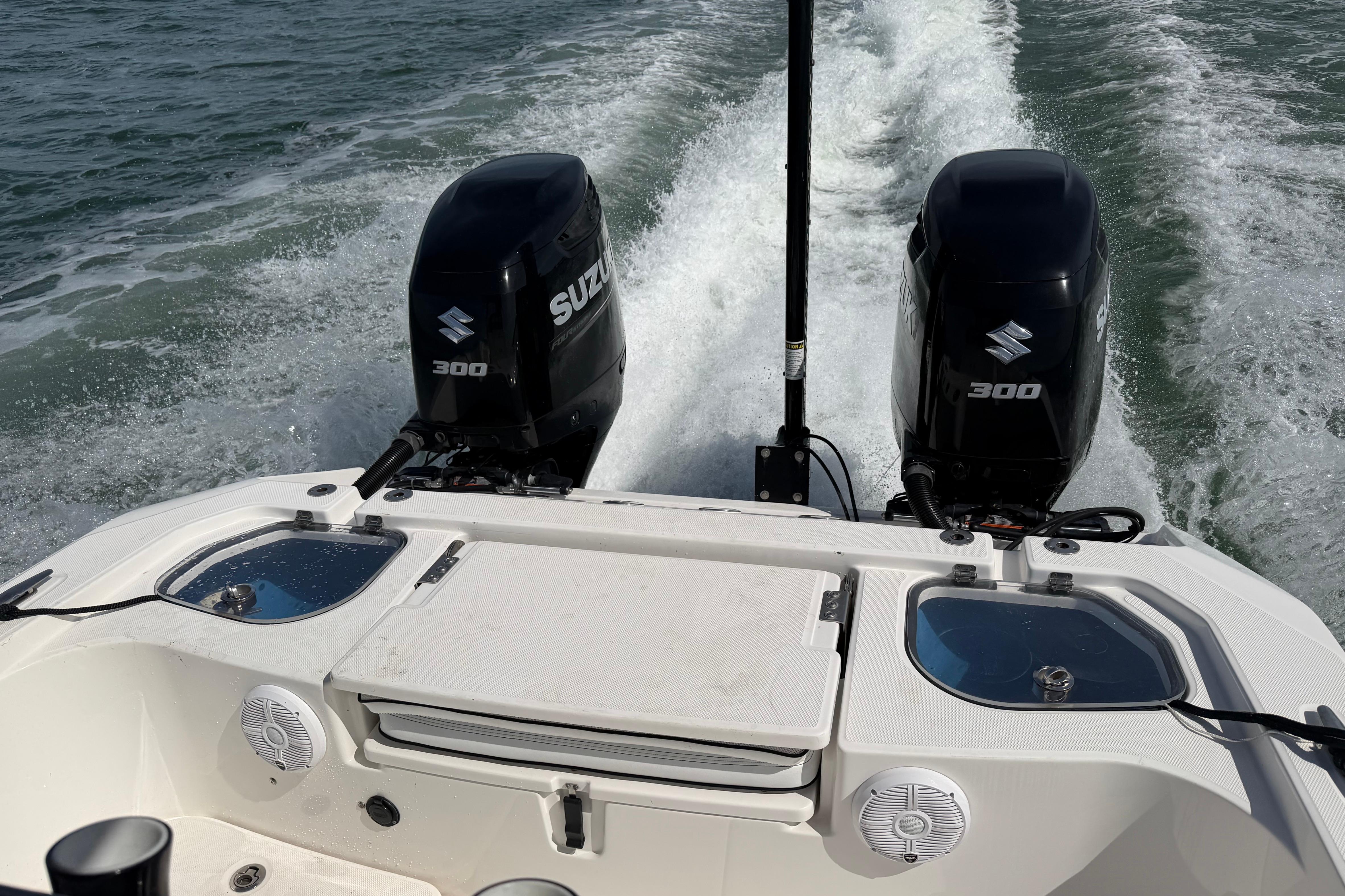 Twin Suzuki 300 engines on a 2020 Sea Cat 260 boat cruising through water.