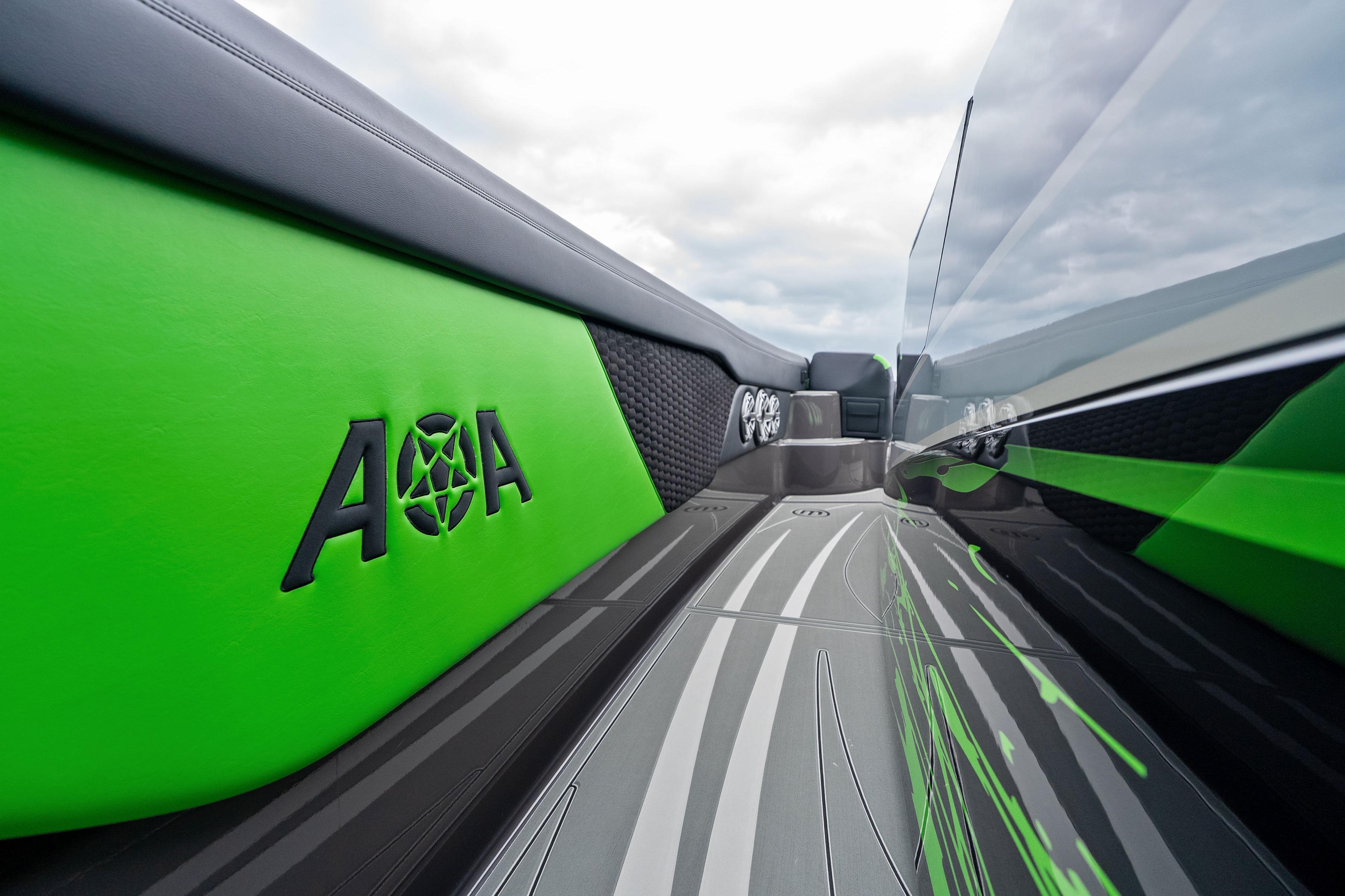 2026 Mystic Powerboats M5200 XL Cabin interior with sleek green and black design.