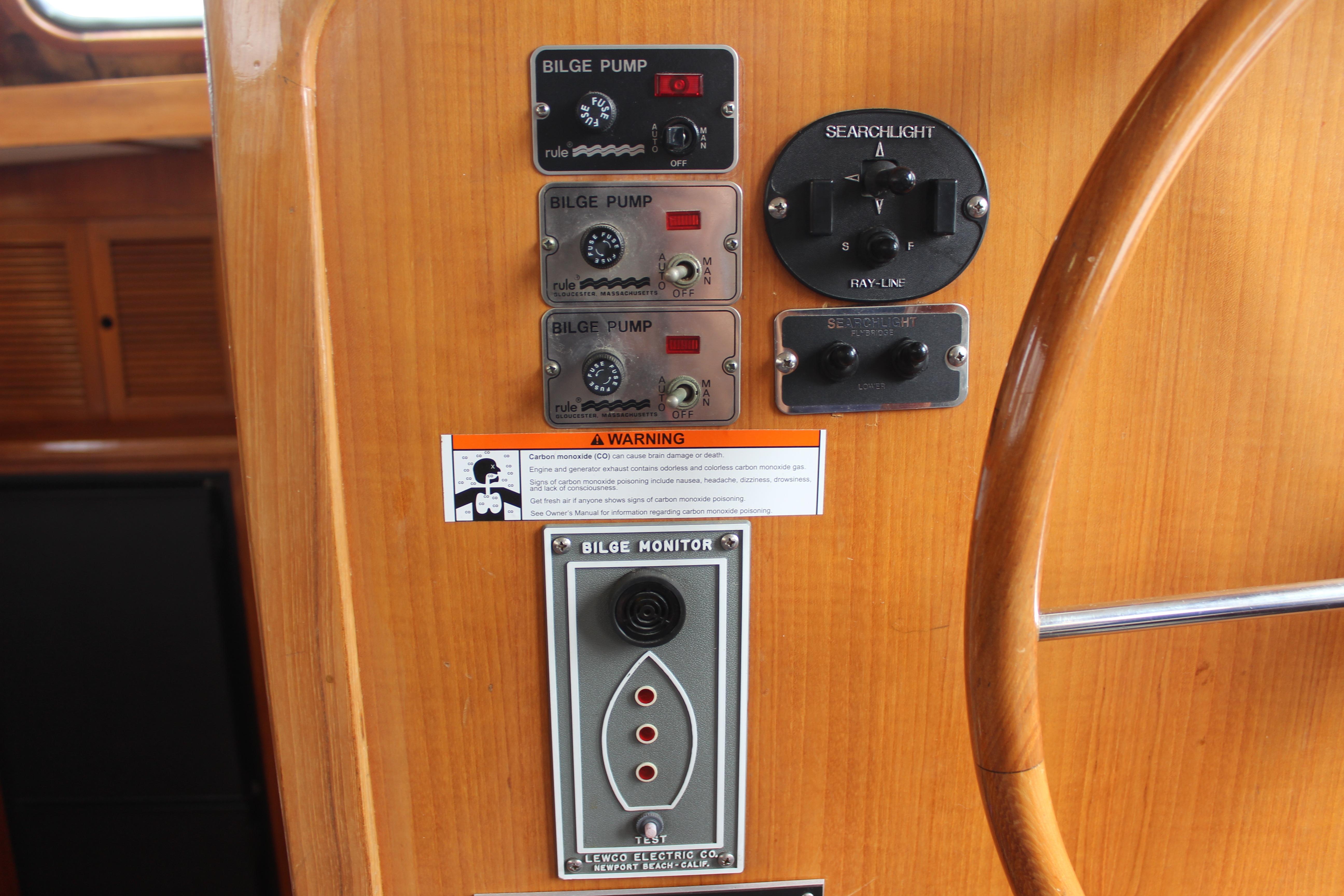 Control panel of a 1986 Kha Shing Spindrift 46 yacht with bilge pump switches.