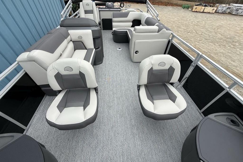 2026 Sun Tracker Fishin' Barge 20 DLX interior with gray and white seating.
