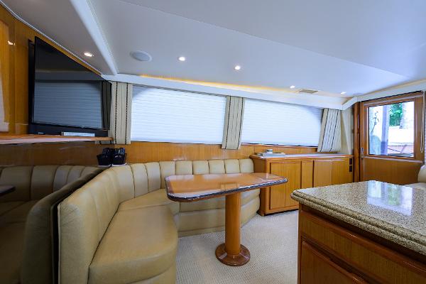 Luxurious interior of a 2000 Viking 50 Convertible yacht with elegant seating and wooden finishes.