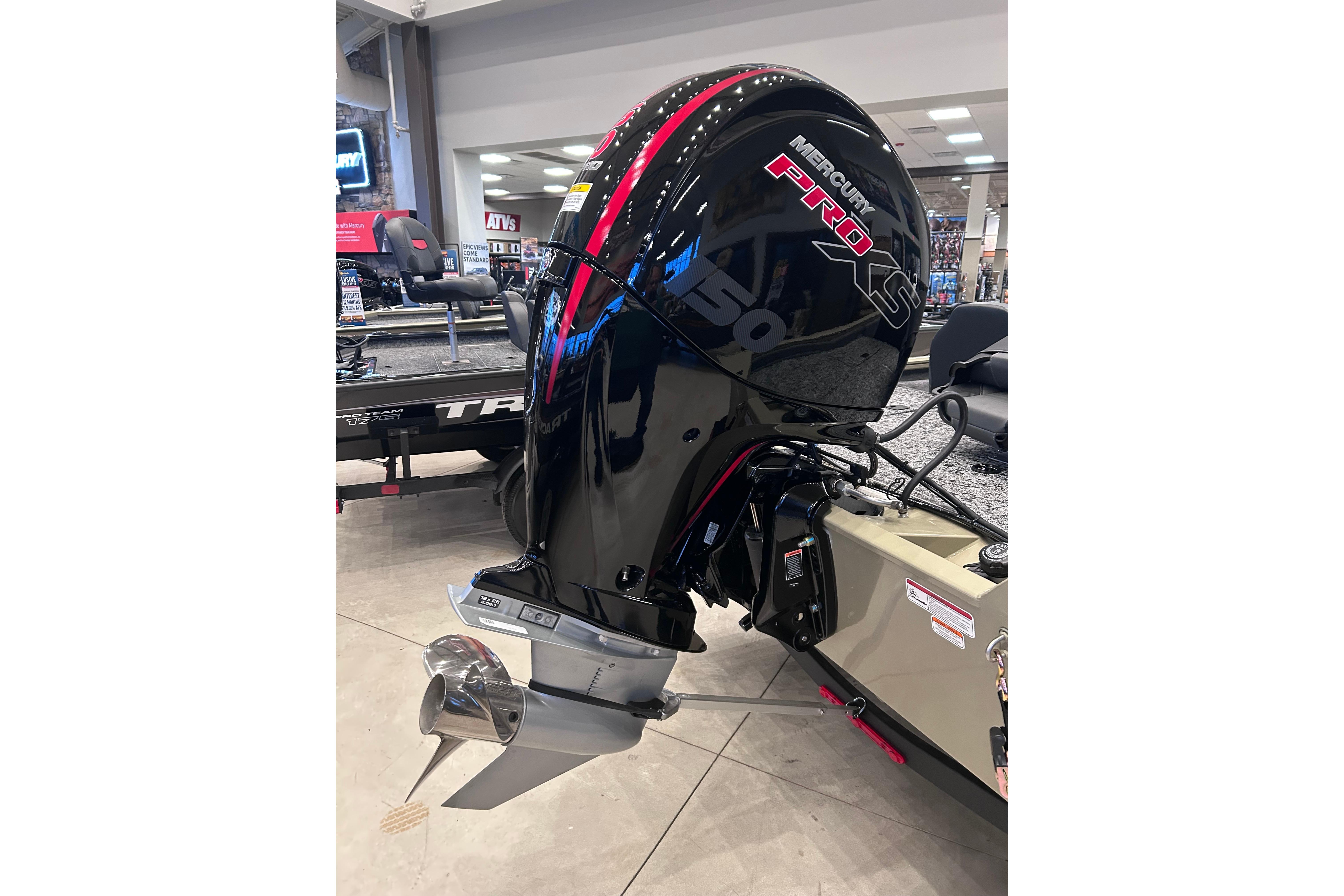2026 Tracker Pro Team 195 with Mercury Pro XS 150 outboard motor in showroom.