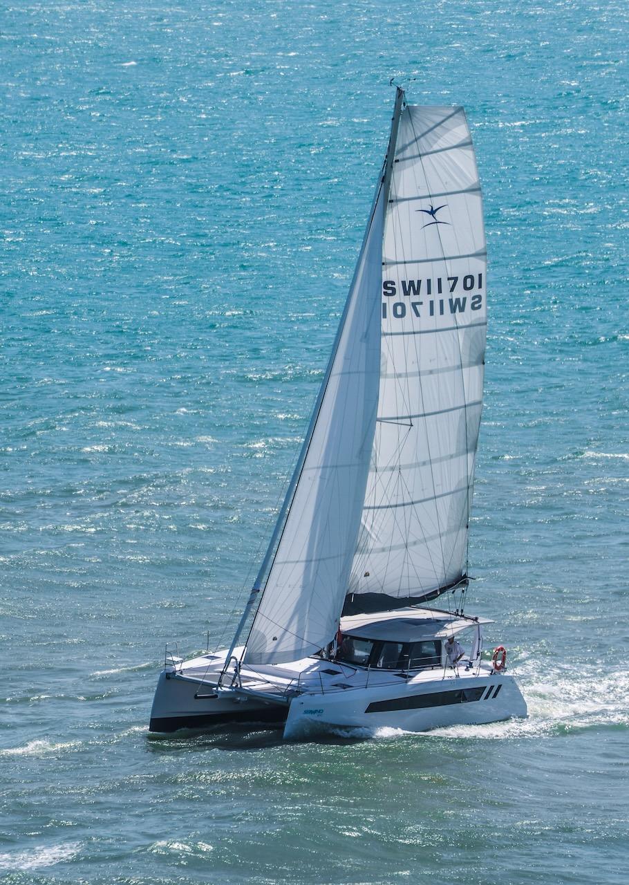 2025 Seawind 1170 catamaran sailing on open ocean waters.