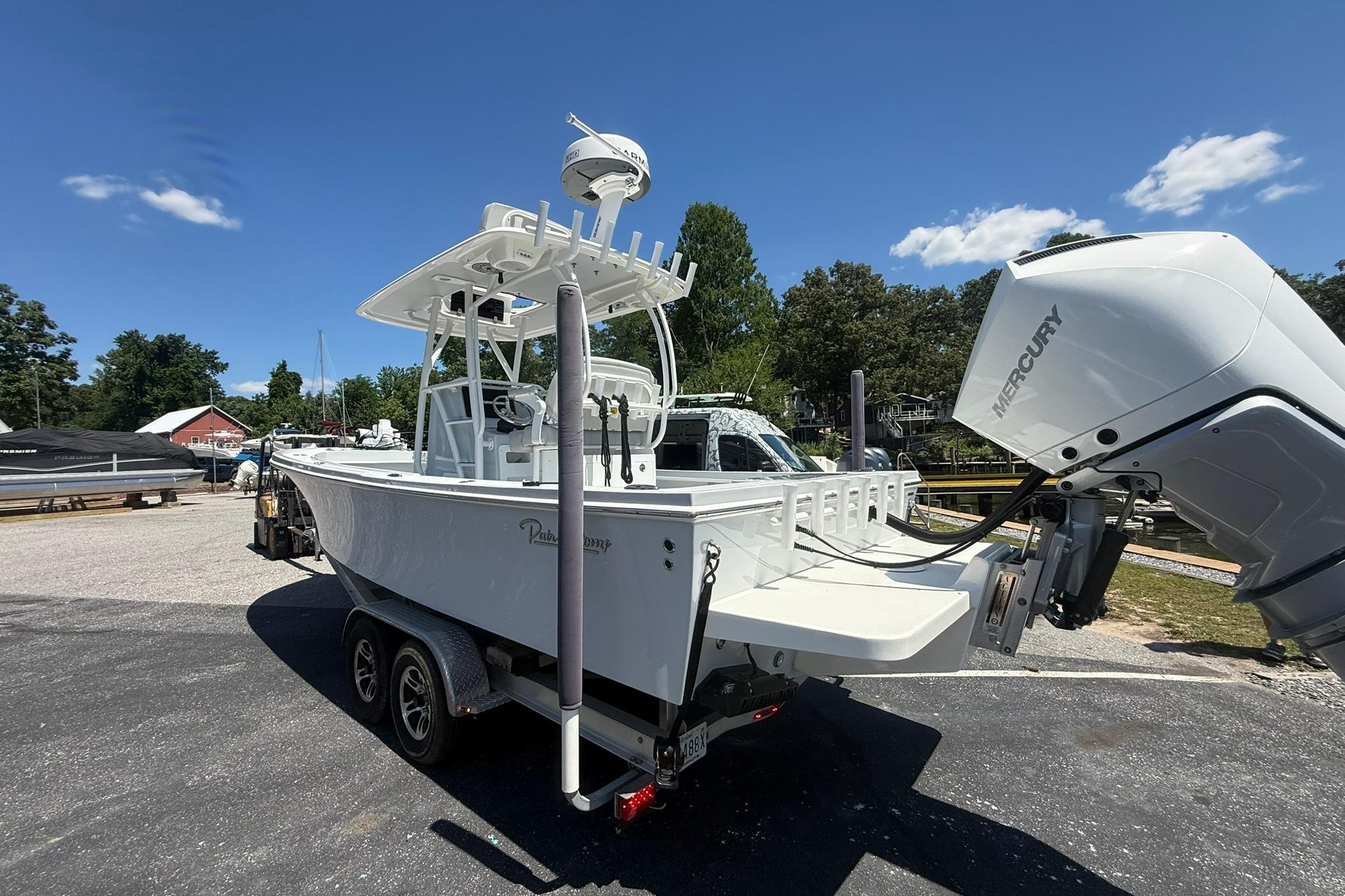 2024 Pair Customs 24 Center Console MV boat with Mercury engine on trailer.