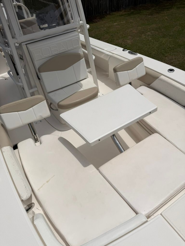 Interior of a 2018 Robalo 246 Cayman SD boat with seating area.