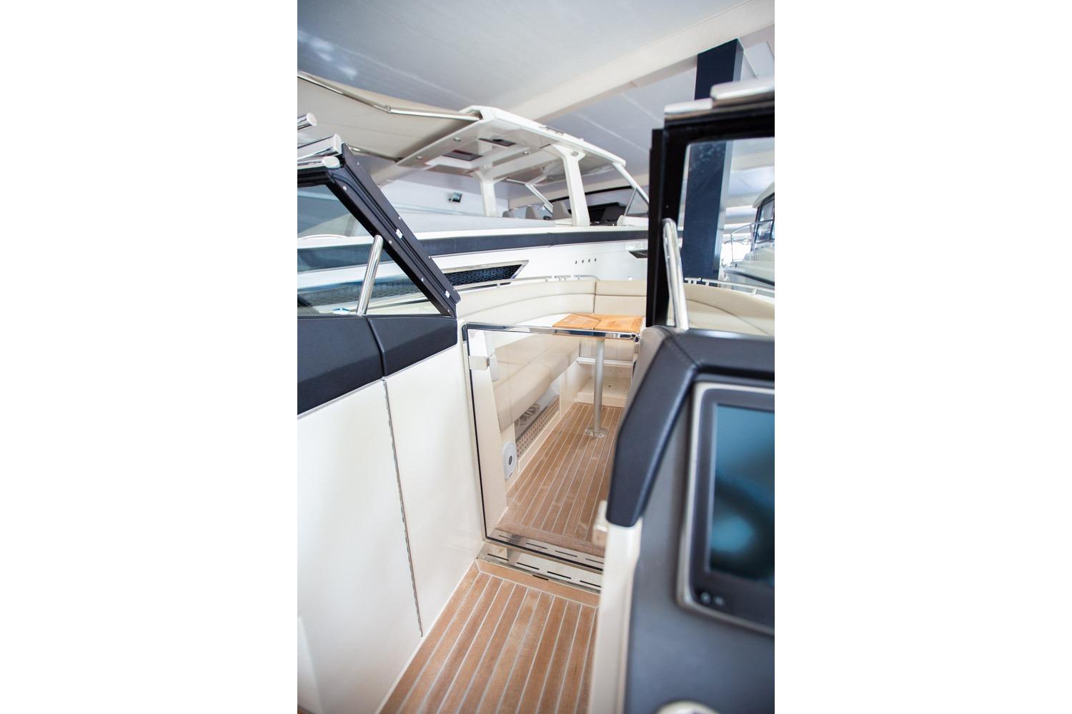 Interior view of 2016 Draco 27RS boat, featuring sleek design and modern amenities.
