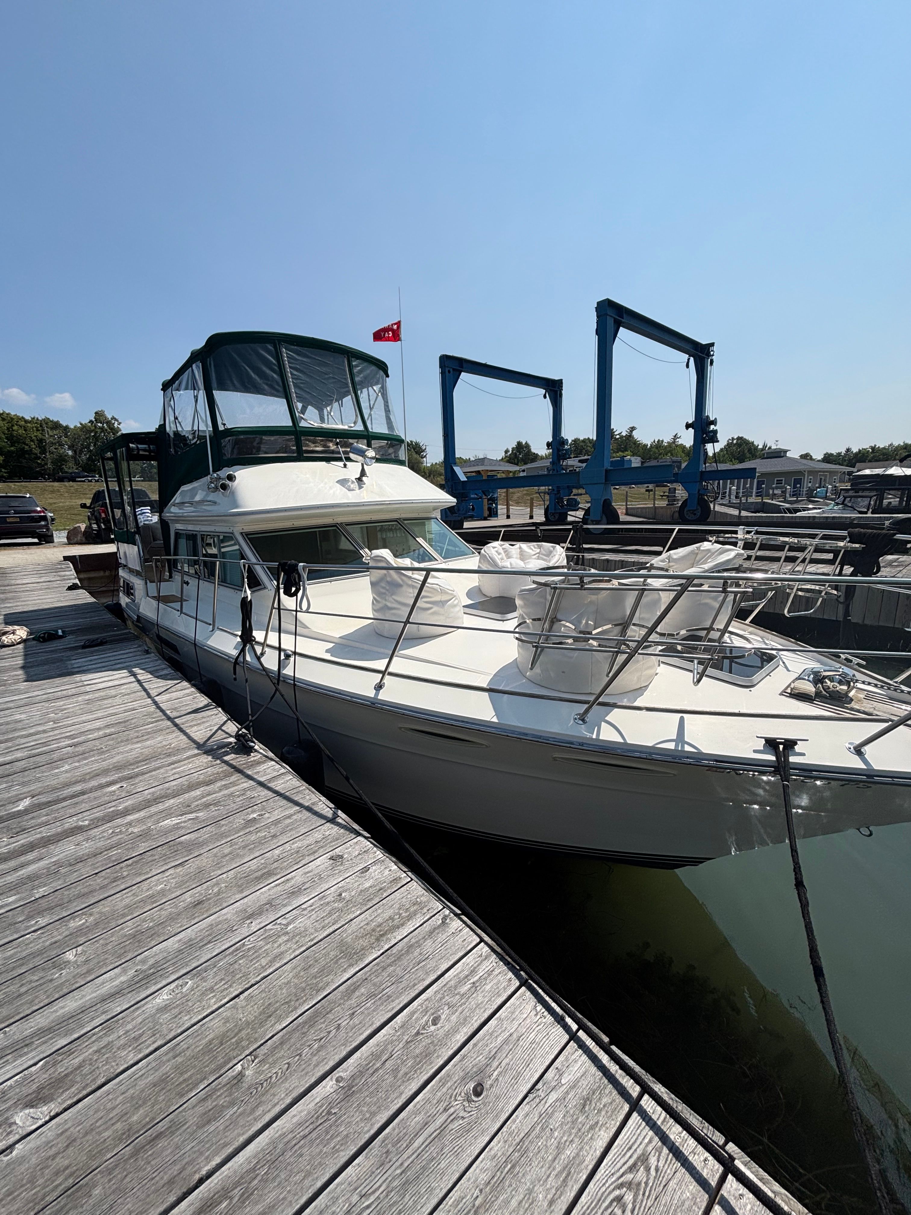 1986 Sea Ray 360 Aft Cabin yacht docked on a sunny day.