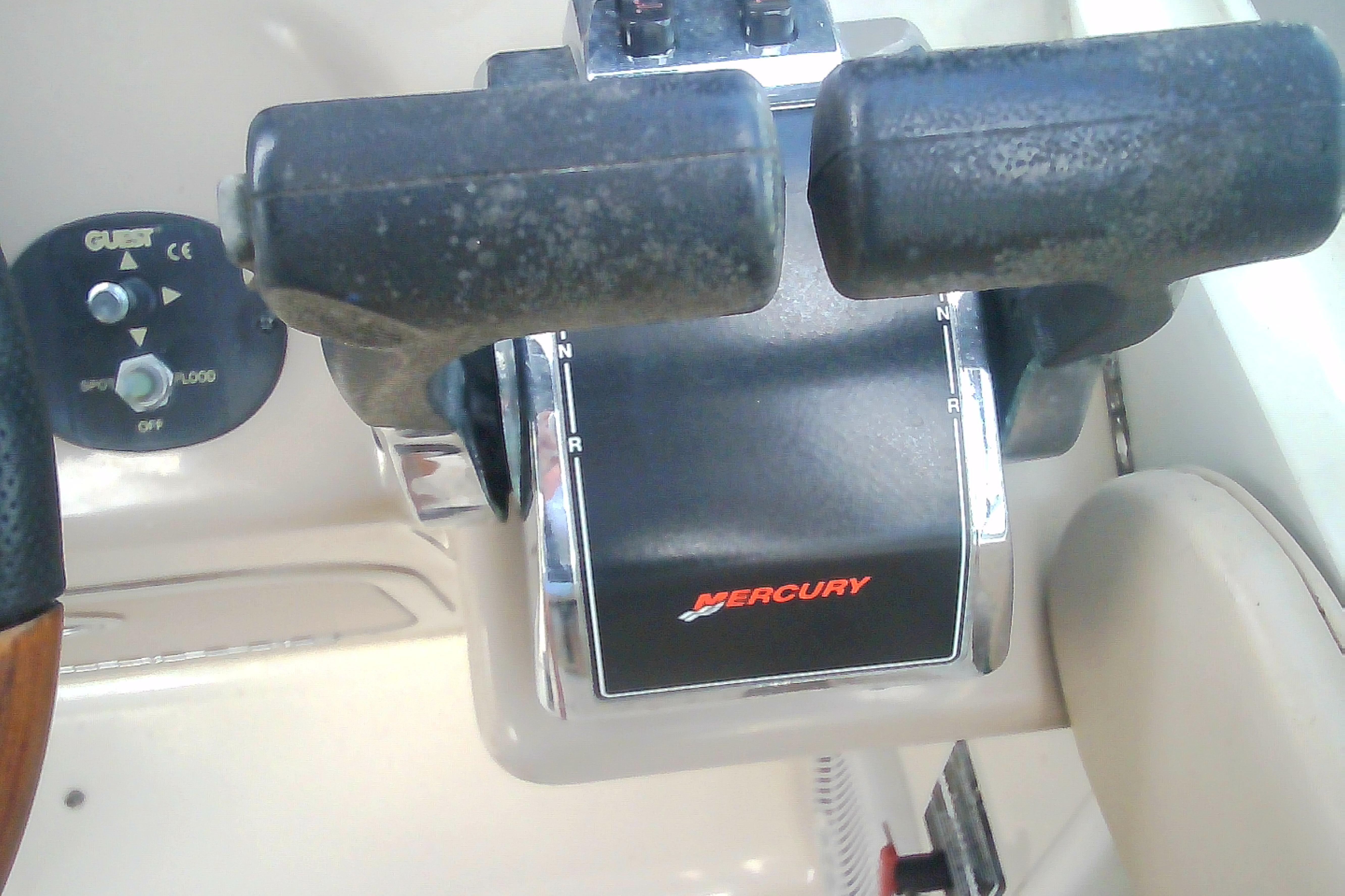 Throttle controls of a 2005 Sea Ray 300 Sundancer boat with Mercury branding.