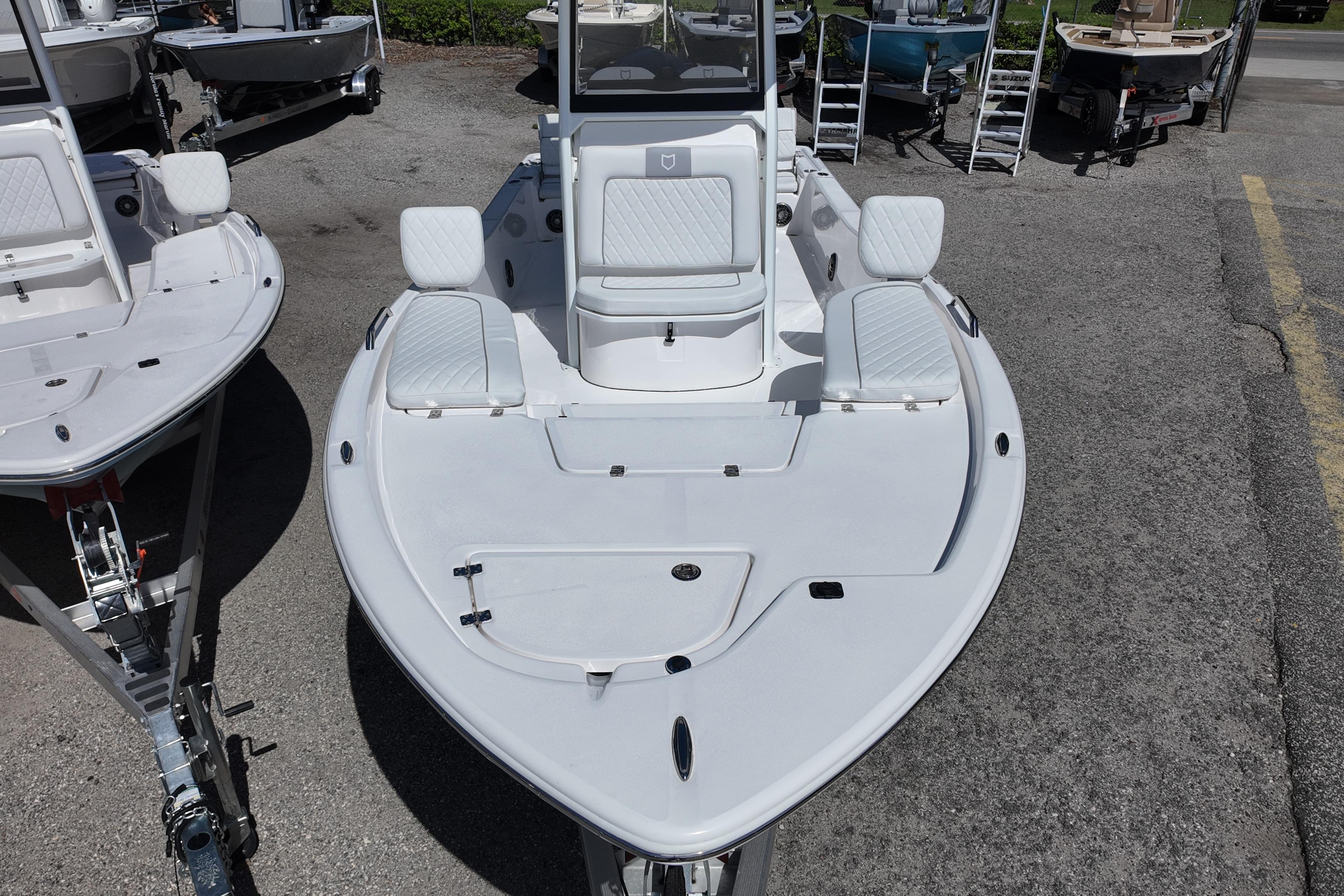 2026 Sea Fox 251 Bay Fox boat, white deck, docked outdoors.