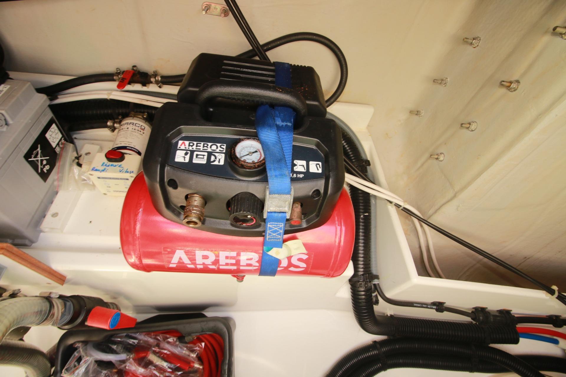 Engine compartment of 2022 Fountaine Pajot Elba 45 Catamaran with AREBOS air compressor.
