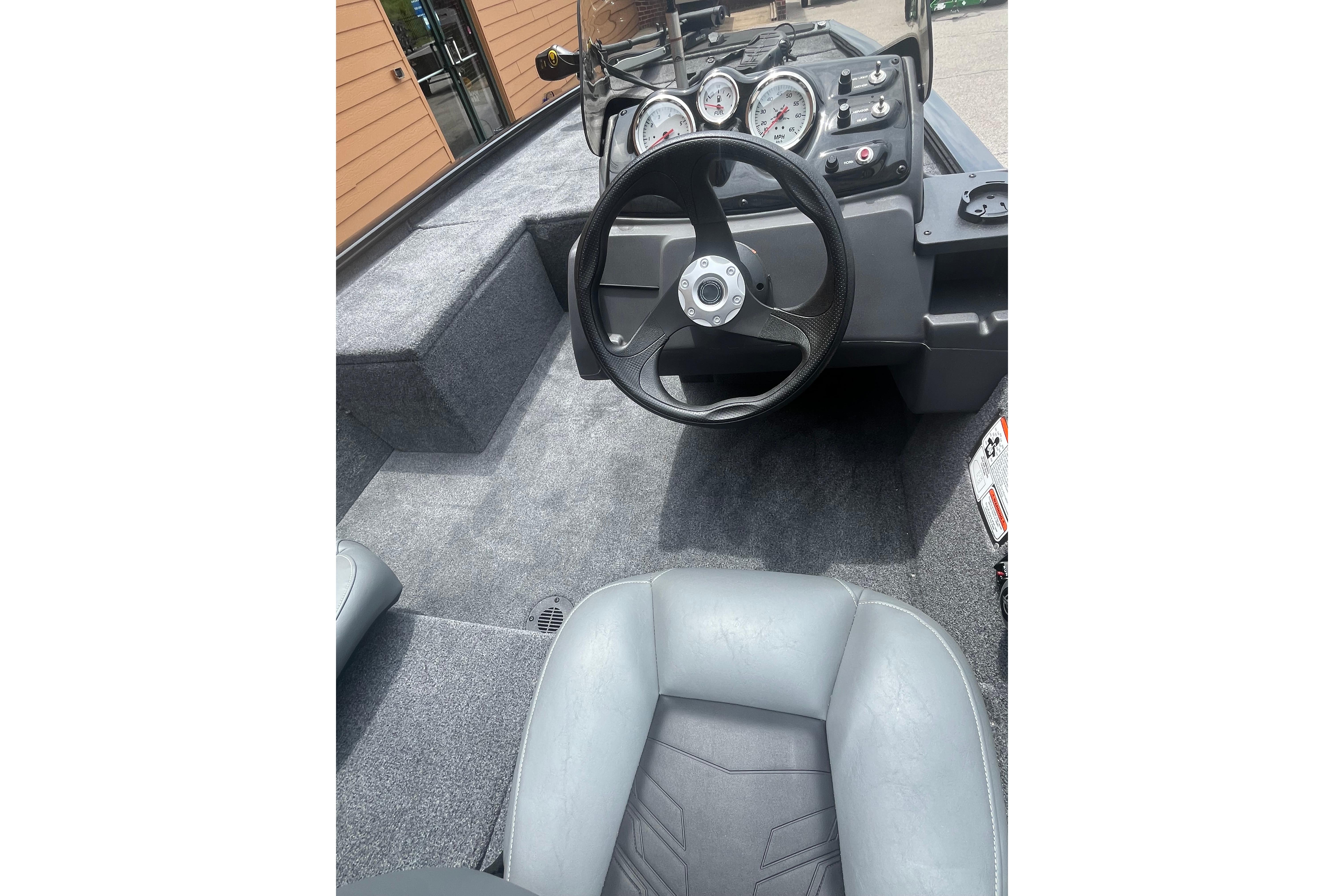 2026 Tracker Pro 170 boat interior with steering wheel and dashboard controls.