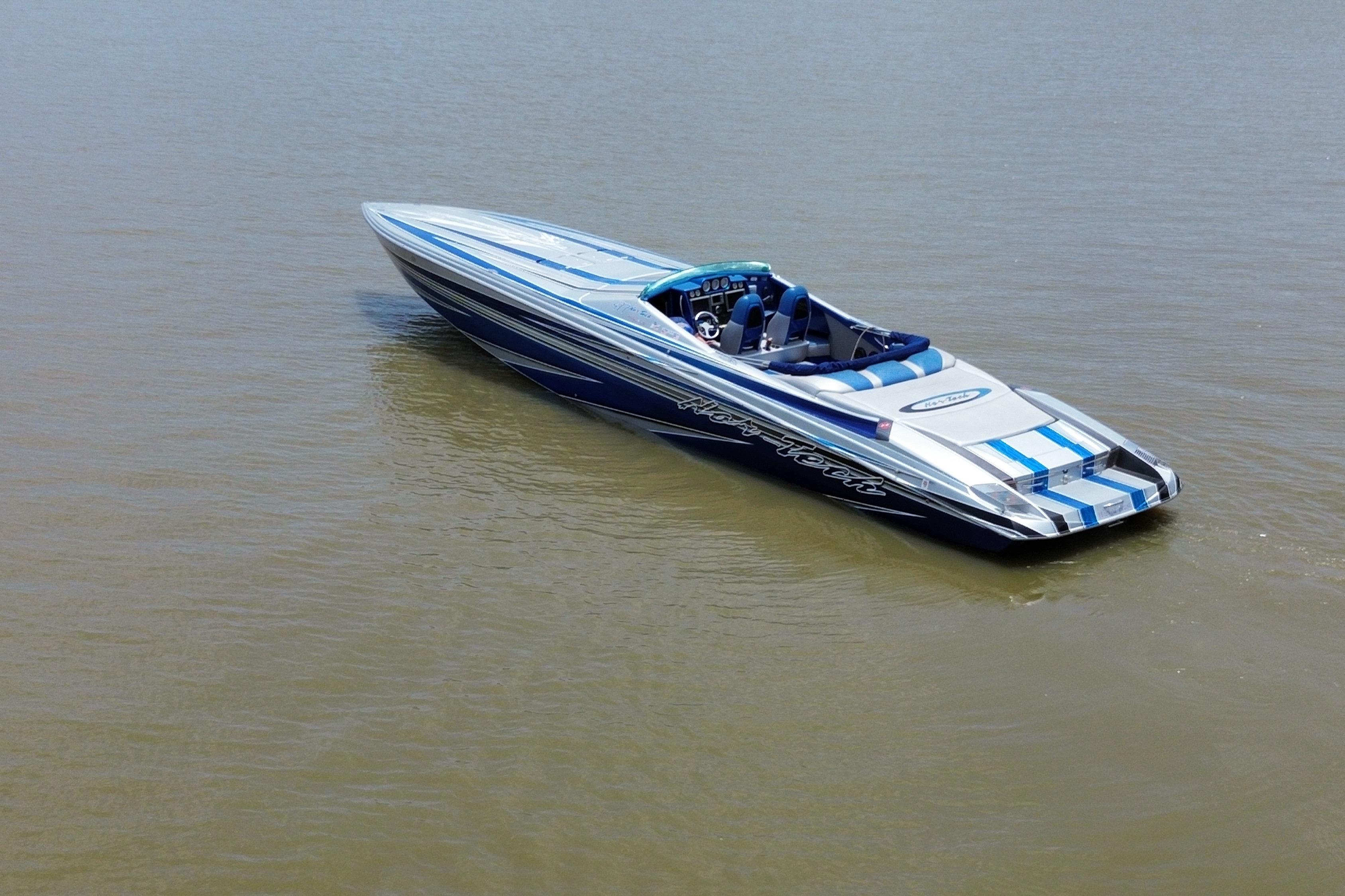 2013 Nor-Tech 477 SPX Vee Bottom boat on calm water, showcasing sleek design.