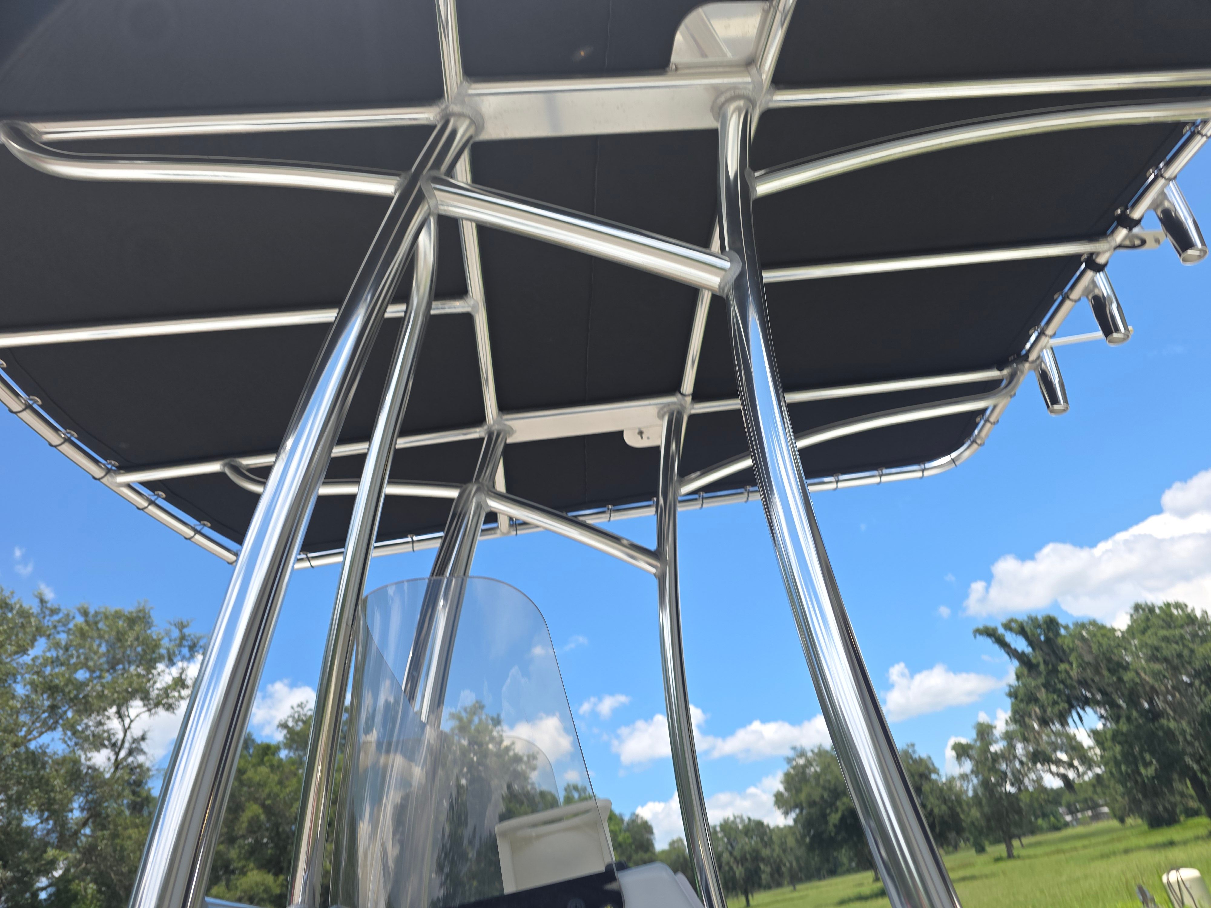 View of a Blazer Bay 2200's T-top from 2019 with blue sky in the background.
