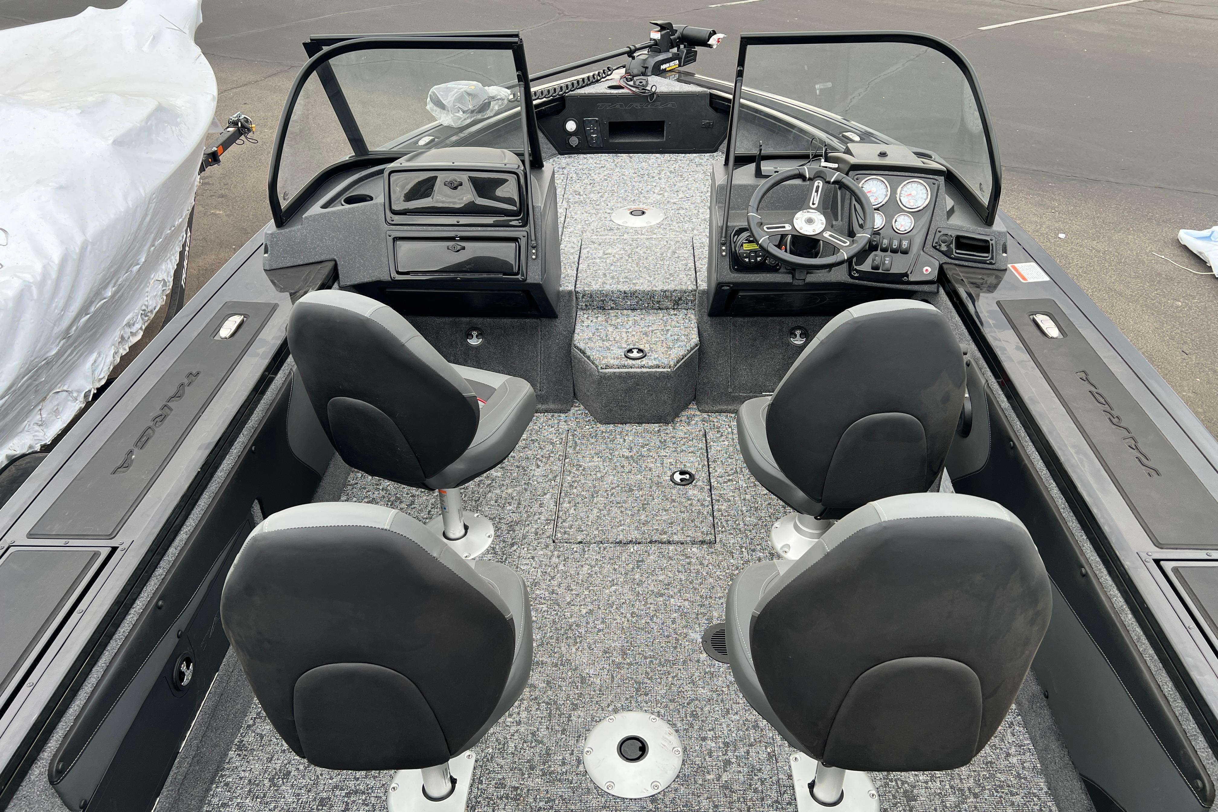 2026 Tracker Targa V-19 Combo boat interior with four seats and steering console.