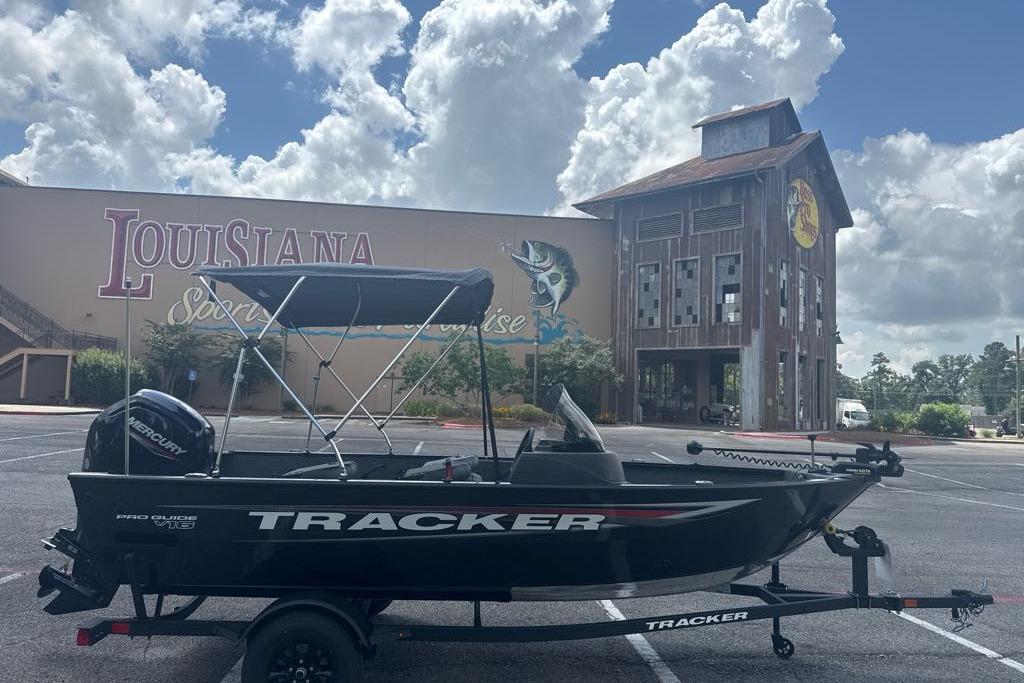 2026 Tracker Pro Guide V-16 SC boat parked outside Louisiana Sports Paradise.