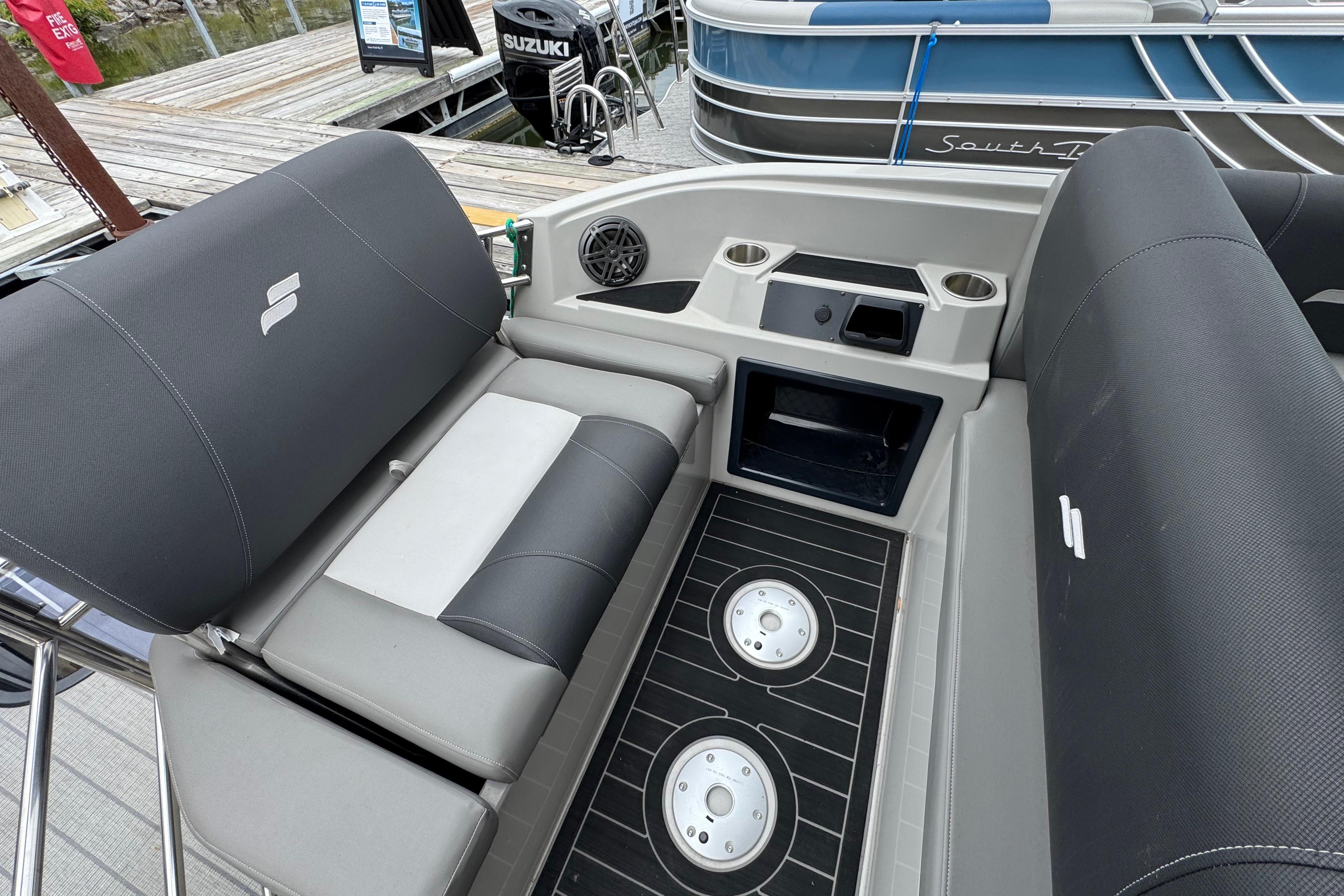 2023 Starcraft MX 25 DL DH boat interior with seating and cup holders.